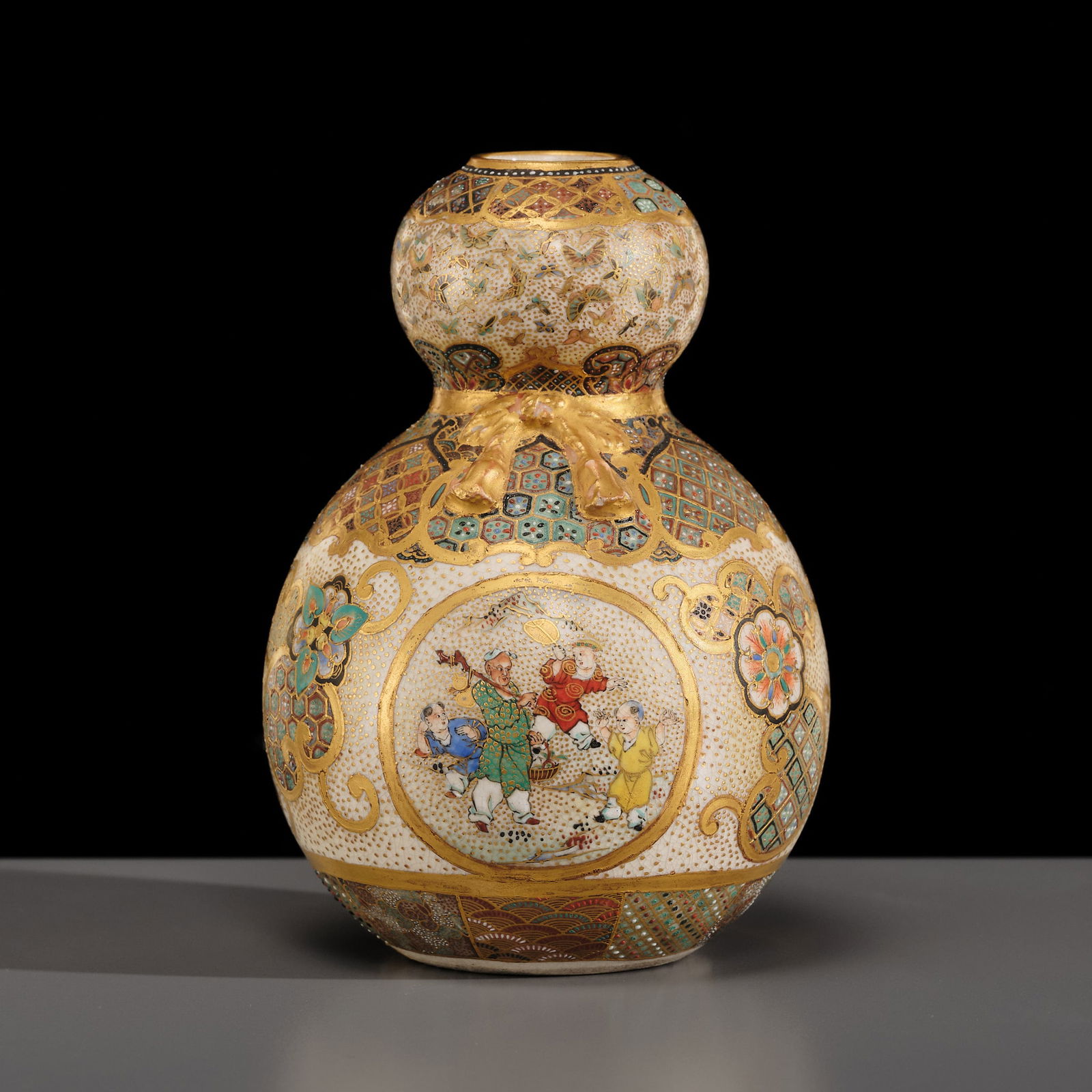 A FINE GOURD-SHAPED SATSUMA EARTHENWARE VASE (1 of 14)