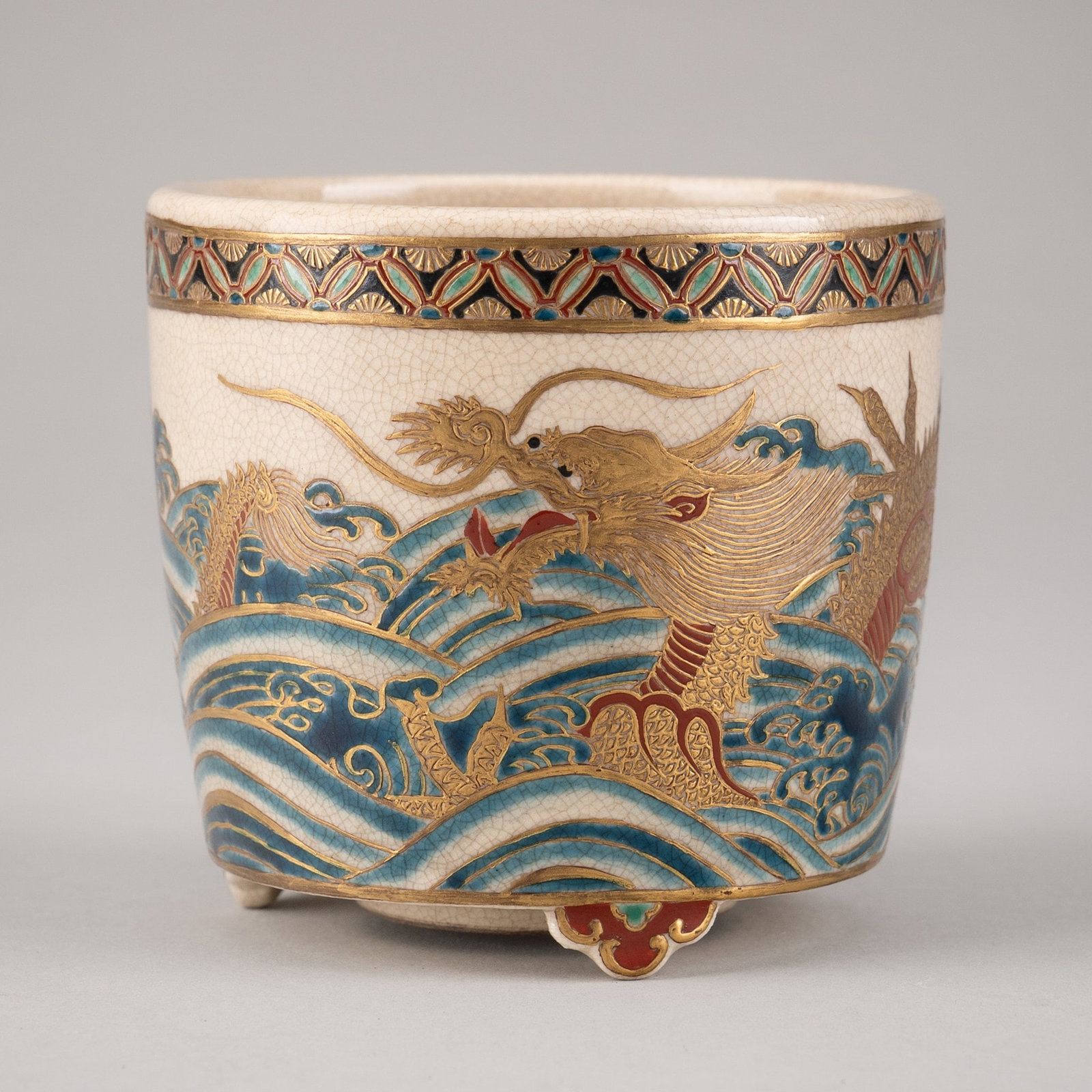 MASONOBU: A SATSUMA PORCELAIN TRIPOD KORO: MASONOBU: A SATSUMA PORCELAIN TRIPOD KORO By Masonobu, signed Masonobu Japan, Meiji period (1868-1912) The slightly tapered cylindrical body rising from three ruyi-head feet, finely painted in gilt an