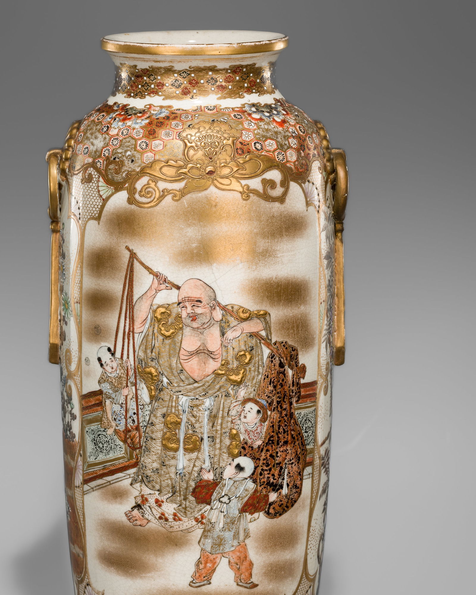 A LARGE SATSUMA CERAMIC VASE WITH A FIGURAL SCENE: A LARGE SATSUMA CERAMIC VASE WITH A FIGURAL SCENE Japan, Meiji period (1868-1912) to Taisho period (1912-1926)Heavily potted, the large ovoid–cylindrical vase gently tapering toward the foot and
