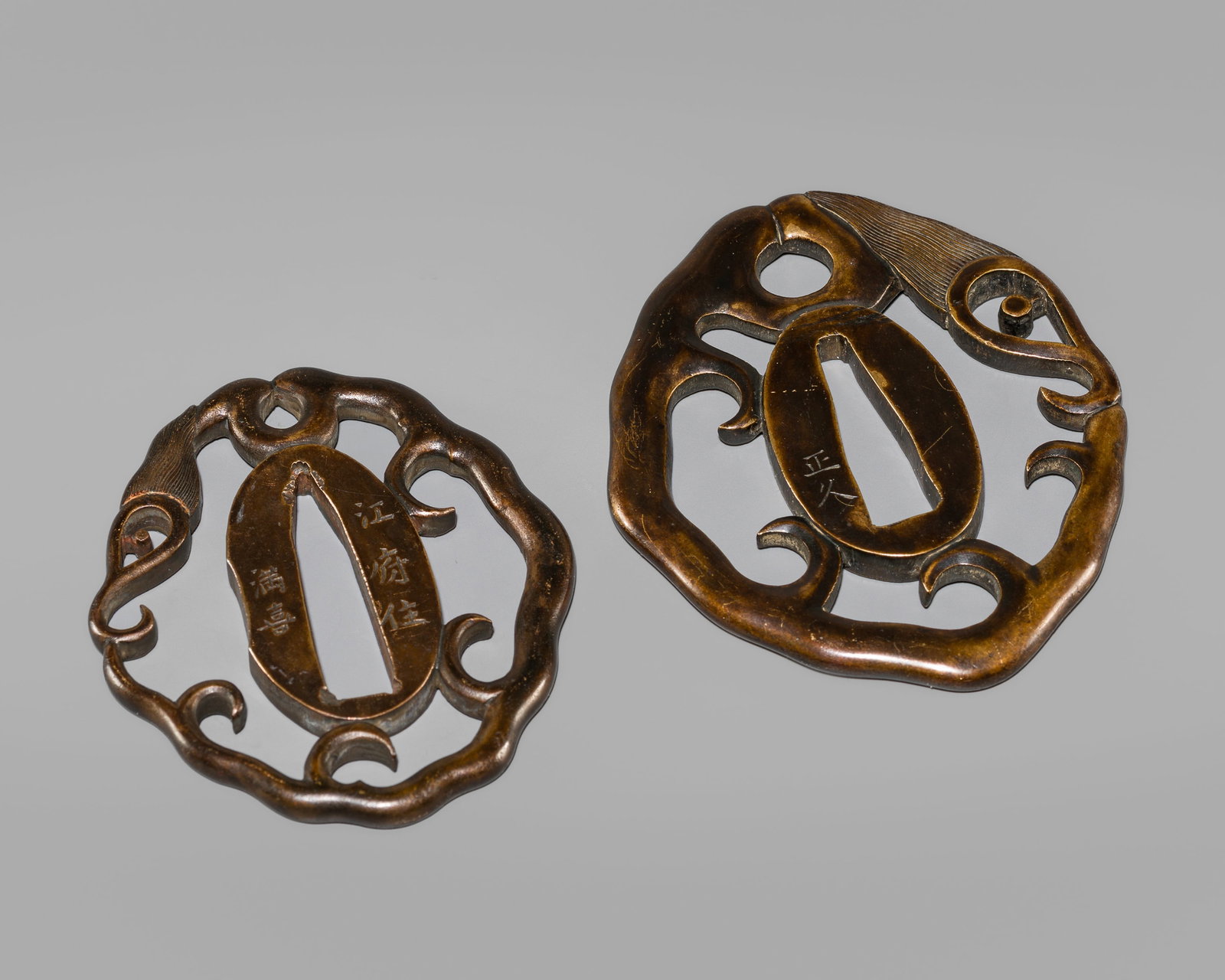 MASAHISA & MITSUYOSHI: A PAIR OF SENTOKU SUKASHI TSUBA OF RAIN DRAGONS: MASAHISA & MITSUYOSHI: A PAIR OF SENTOKU SUKASHI TSUBA OF RAIN DRAGONS By Masahisa and Mitsuyoshi, one signed Masahisa, the other Kōfujū Mitsuyoshi Japan, Edo period (1615-1868) Each tsuba i