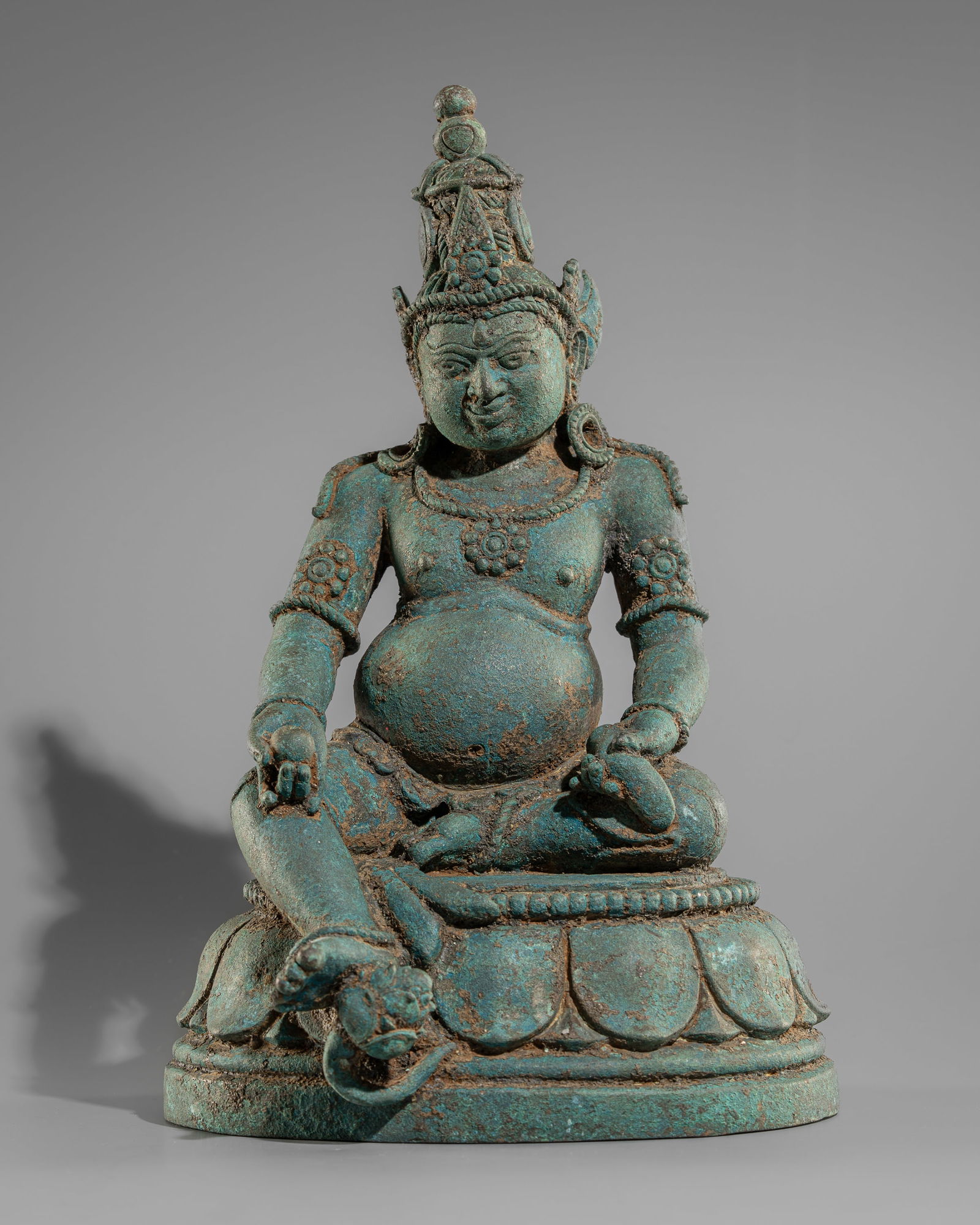 A RARE BRONZE FIGURE OF JAMBHALA, MAJAPAHIT PERIOD, 14TH CENTURY (1 of 14)