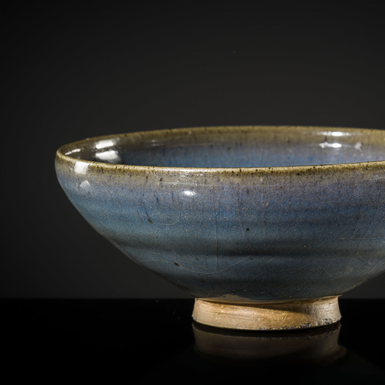A LARGE BLUE-GLAZED JUN BOWL, NORTHERN SONG-YUAN DYNASTY: A LARGE BLUE-GLAZED JUN BOWL, NORTHERN SONG-YUAN DYNASTY China, 12th-14th century. Finely potted with deep, rounded sides rising from a short foot, covered overall with an opaque b