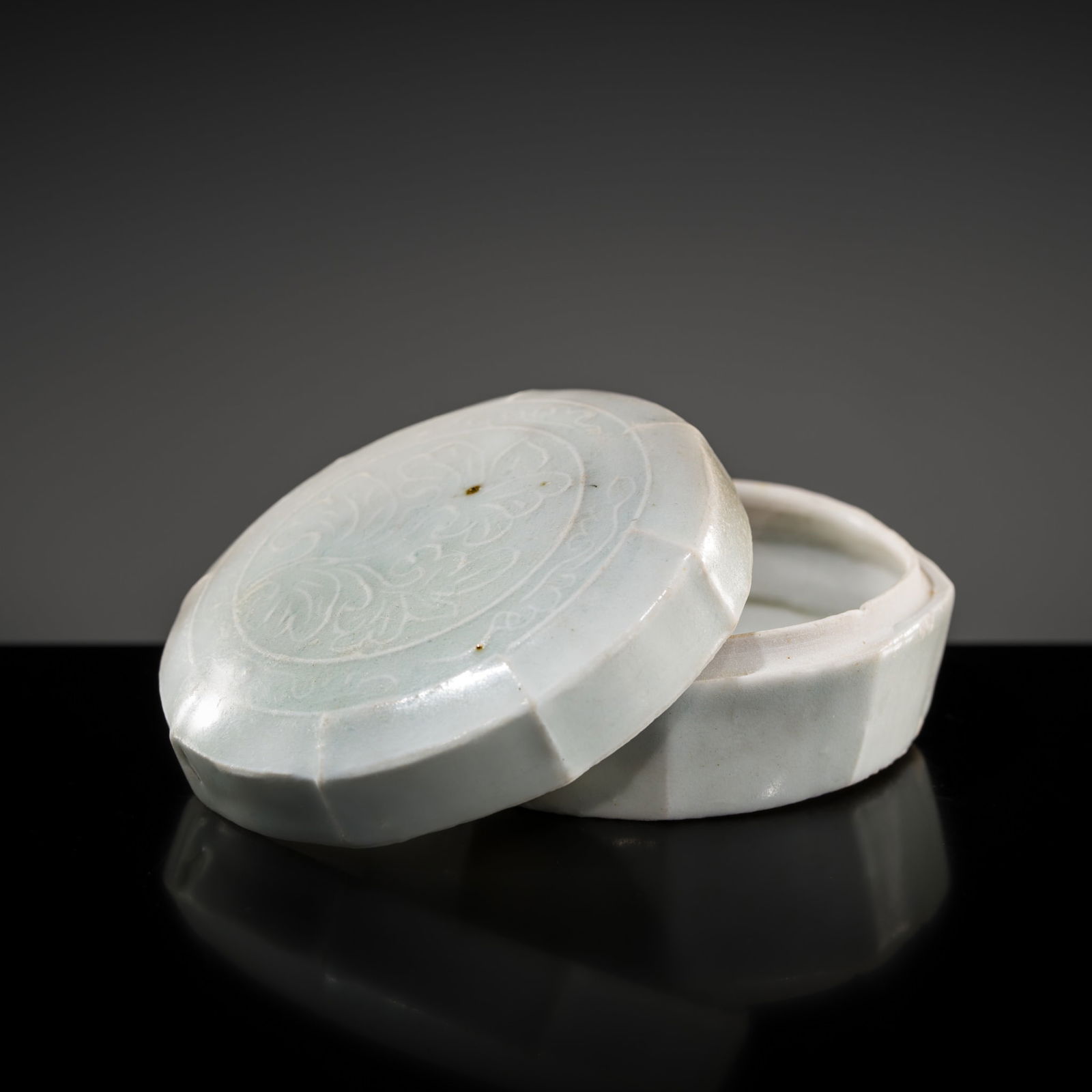 A QINGBAI WARE LOBED 'LOTUS' BOX AND COVER, SOUTHERN SONG TO YUAN DYNASTY: A QINGBAI WARE LOBED 'LOTUS' BOX AND COVER, SOUTHERN SONG TO YUAN DYNASTY China, 12th-13th century. Finely modeled, of octagonal form, the box with gently tapering sides, surmounted by a slightly dom