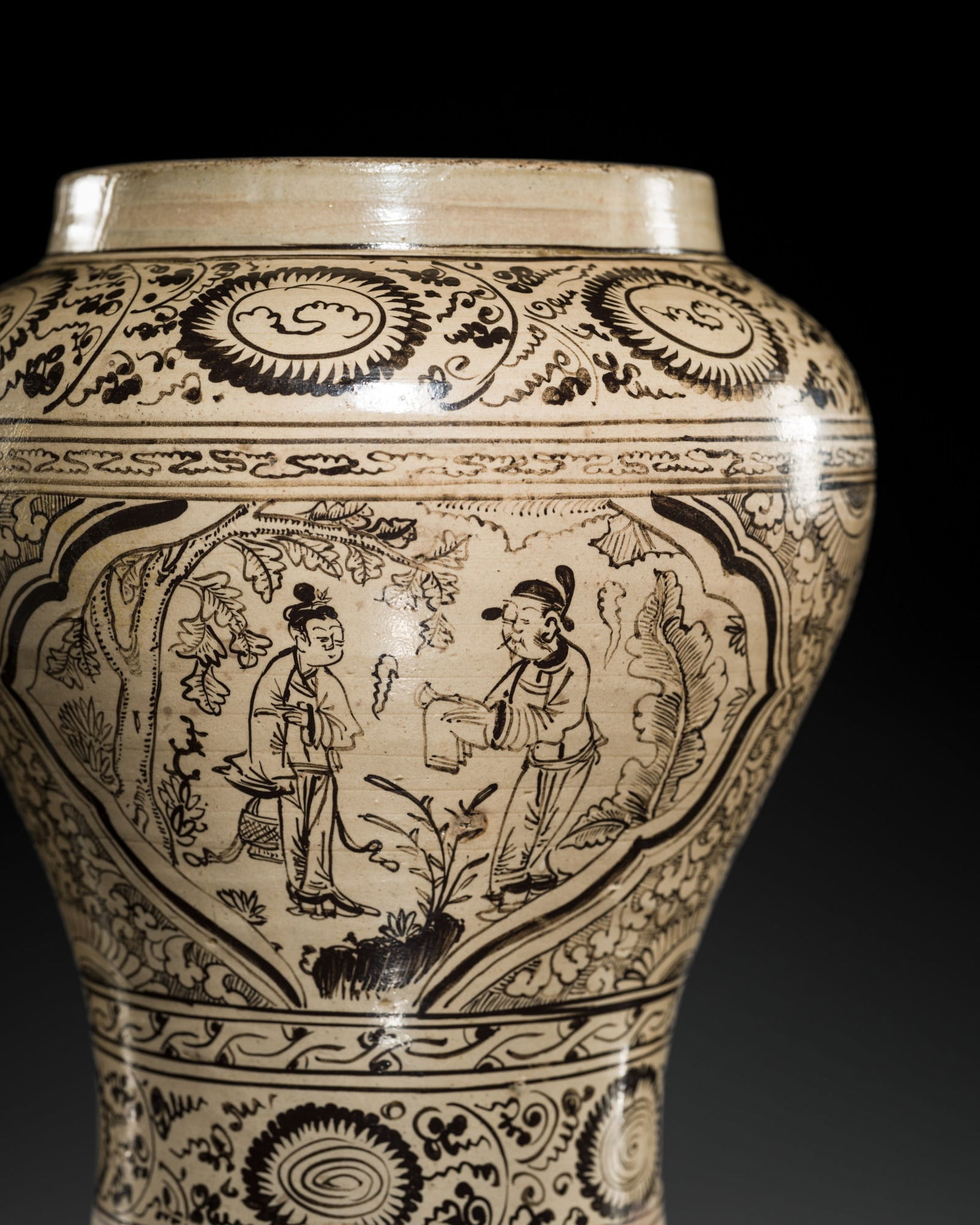 A CIZHOU PAINTED 'FIGURAL' BALUSTER VASE, YUAN-EARLY MING DYNASTY: A CIZHOU PAINTED 'FIGURAL' BALUSTER VASE, YUAN-EARLY MING DYNASTY China, 14th century. The narrow lower body sweeping to a broad shoulder and rising to an upright rim, covered overall in an c