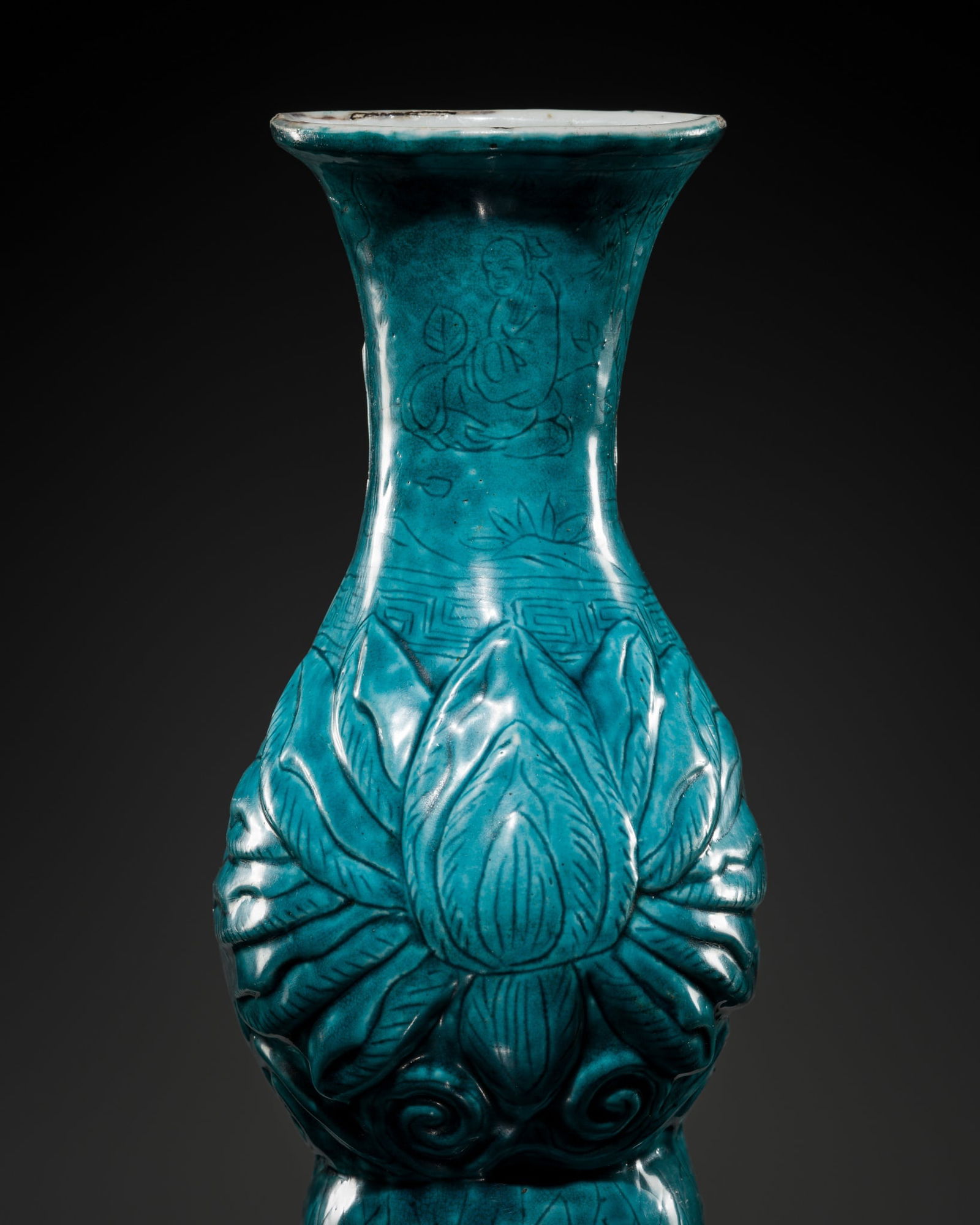 AN EXTREMELY RARE TURQUOISE-GLAZED 'LOTUS' WALL VASE, WANLI MARK AND PERIOD: AN EXTREMELY RARE TURQUOISE-GLAZED 'LOTUS' WALL VASE, WANLI MARK AND PERIOD China, 1572-1620. Of half-baluster form, rising from a slightly recessed base to a broad, flaring mouth with a gently evert