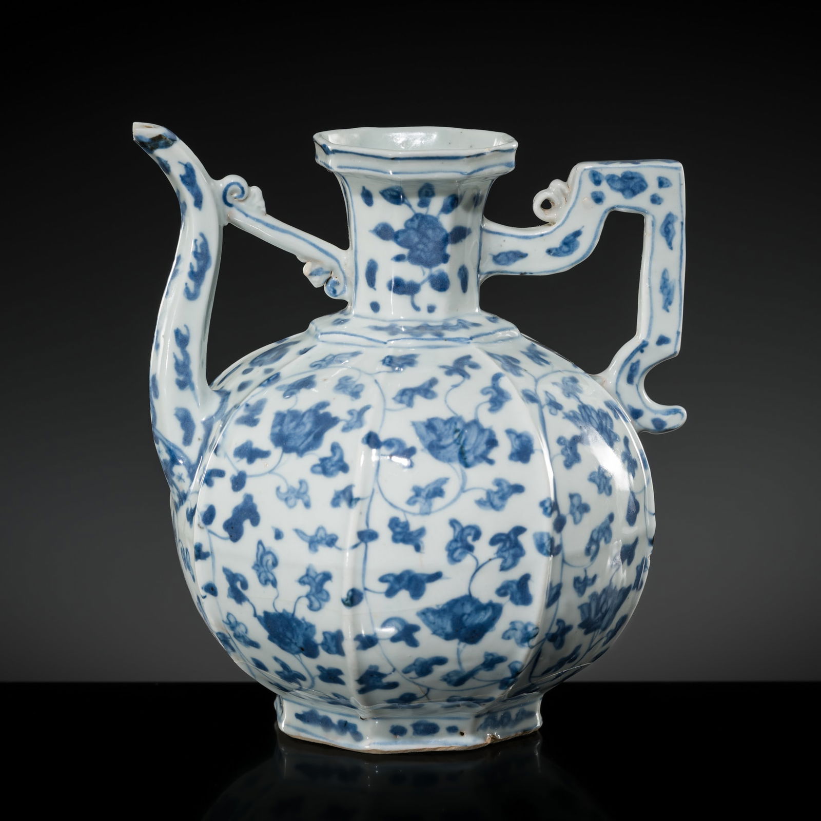 A RARE BLUE AND WHITE 'LOTUS' EWER, 15TH TO MID-16TH CENTURY: A RARE BLUE AND WHITE 'LOTUS' EWER, 15TH TO MID-16TH CENTURY Published: Jean-Paul Desroches (ed.) et al, Two Americans in Paris. A Quest for Asian Art, Paris, 2016, p. 175, no. 284.