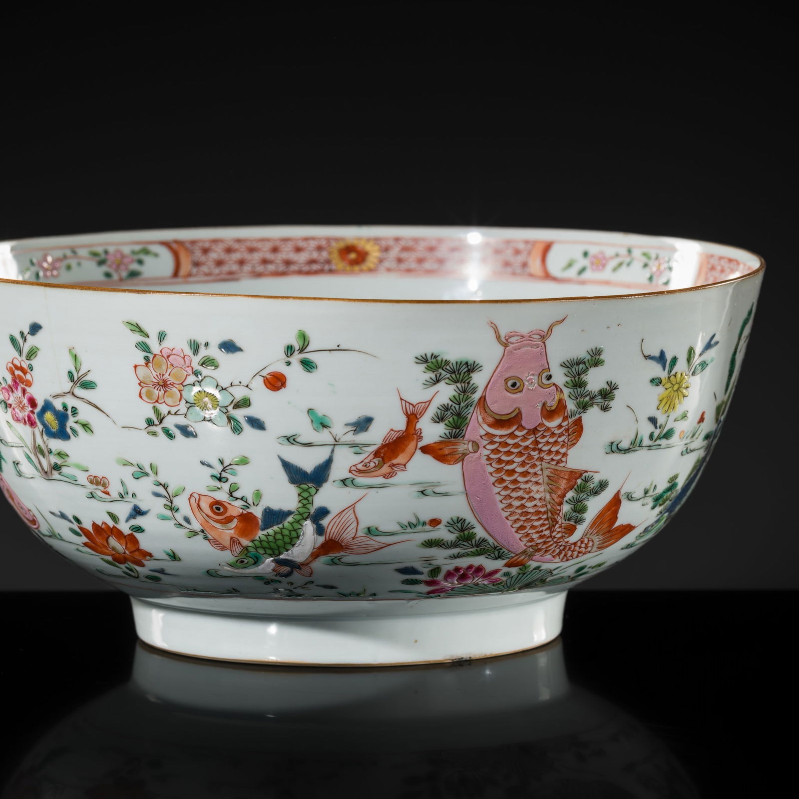 A LARGE FAMILLE ROSE 'LOTUS POND' BOWL, QING DYNASTY: A LARGE FAMILLE ROSE 'LOTUS POND' BOWL, QING DYNASTY China, 18th -19th century. Delicately potted, the deep sides are supported on a short, straight foot and rise to a gently evert