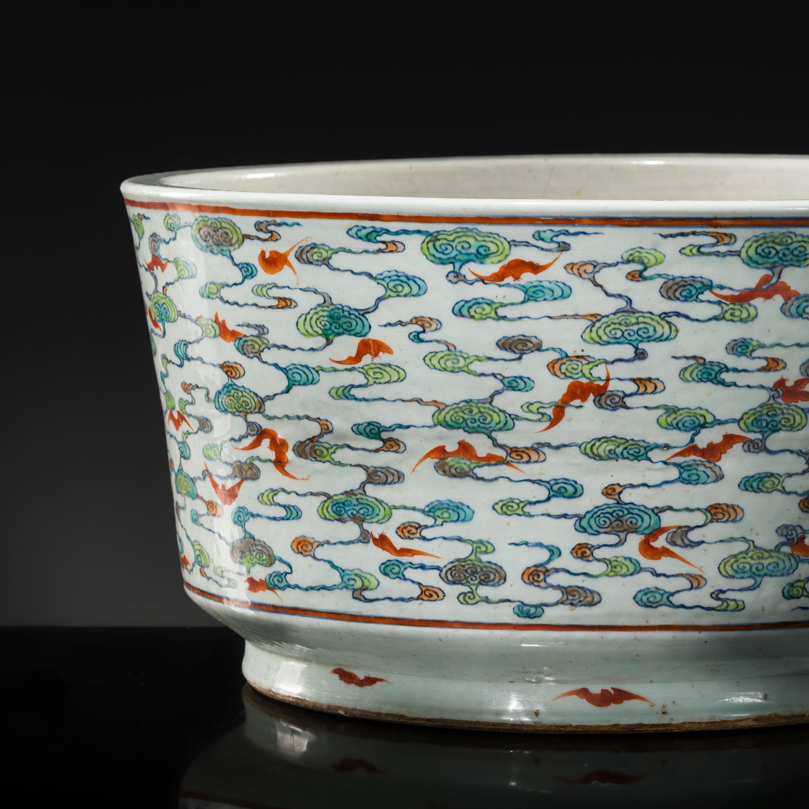 A LARGE AND MASSIVE (57 CM) DOUCAI 'HUNDRED BATS' JARDINIÈRE, QING DYNASTY: A LARGE AND MASSIVE (57 CM) DOUCAI 'HUNDRED BATS' JARDINIÈRE, QING DYNASTY China, 18th-19th century. Finely potted, of broad cylindrical form, rising from a recessed base to a