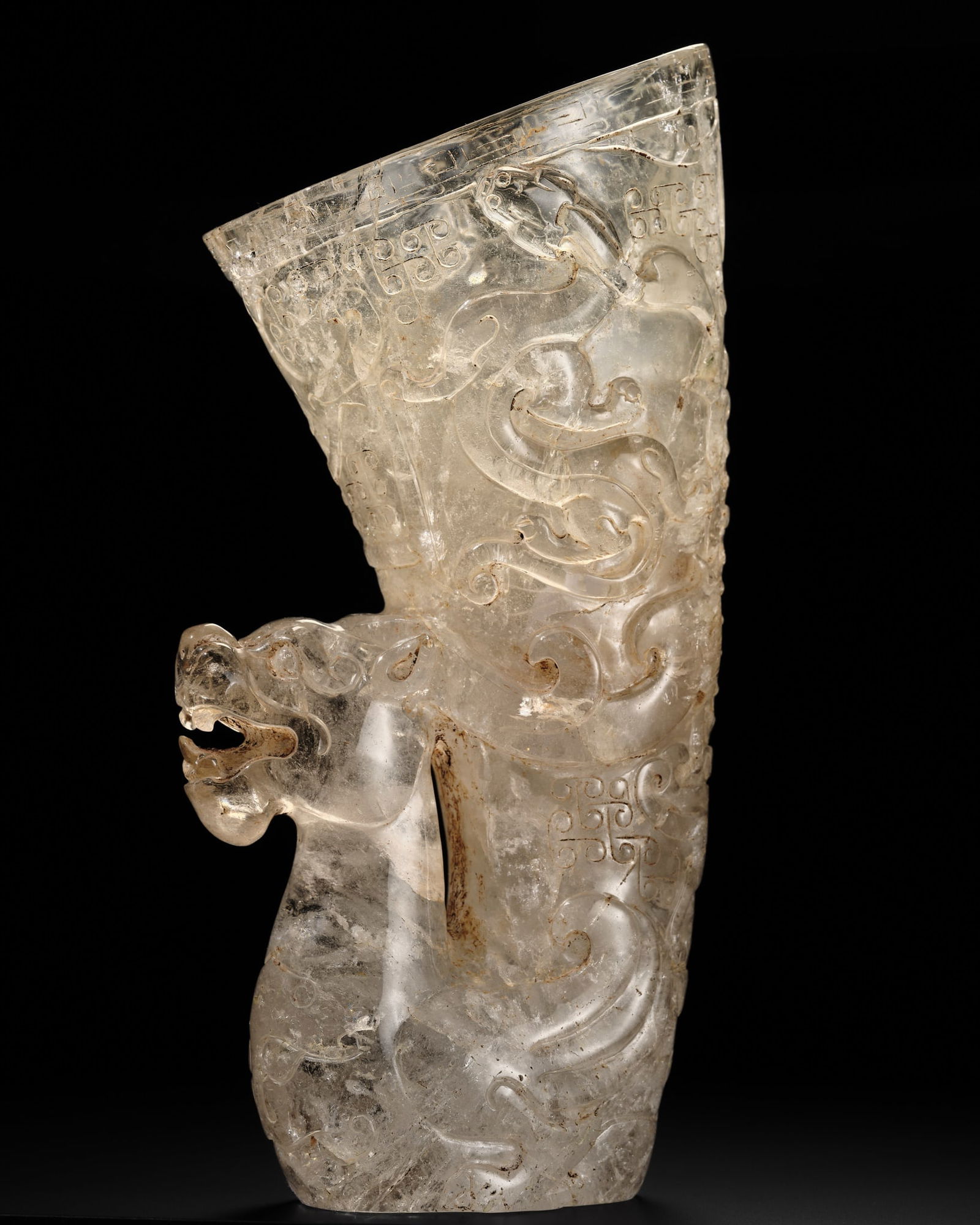 A LARGE AND IMPORTANT ROCK CRYSTAL RHYTON, HAN DYNASTY: A LARGE AND IMPORTANT ROCK CRYSTAL RHYTON, HAN DYNASTY Published: Jean-Paul Desroches (ed.) et al, The Beginning of the World. Dragons, Phoenix and Other Chimera, Fondation Baur, Geneva