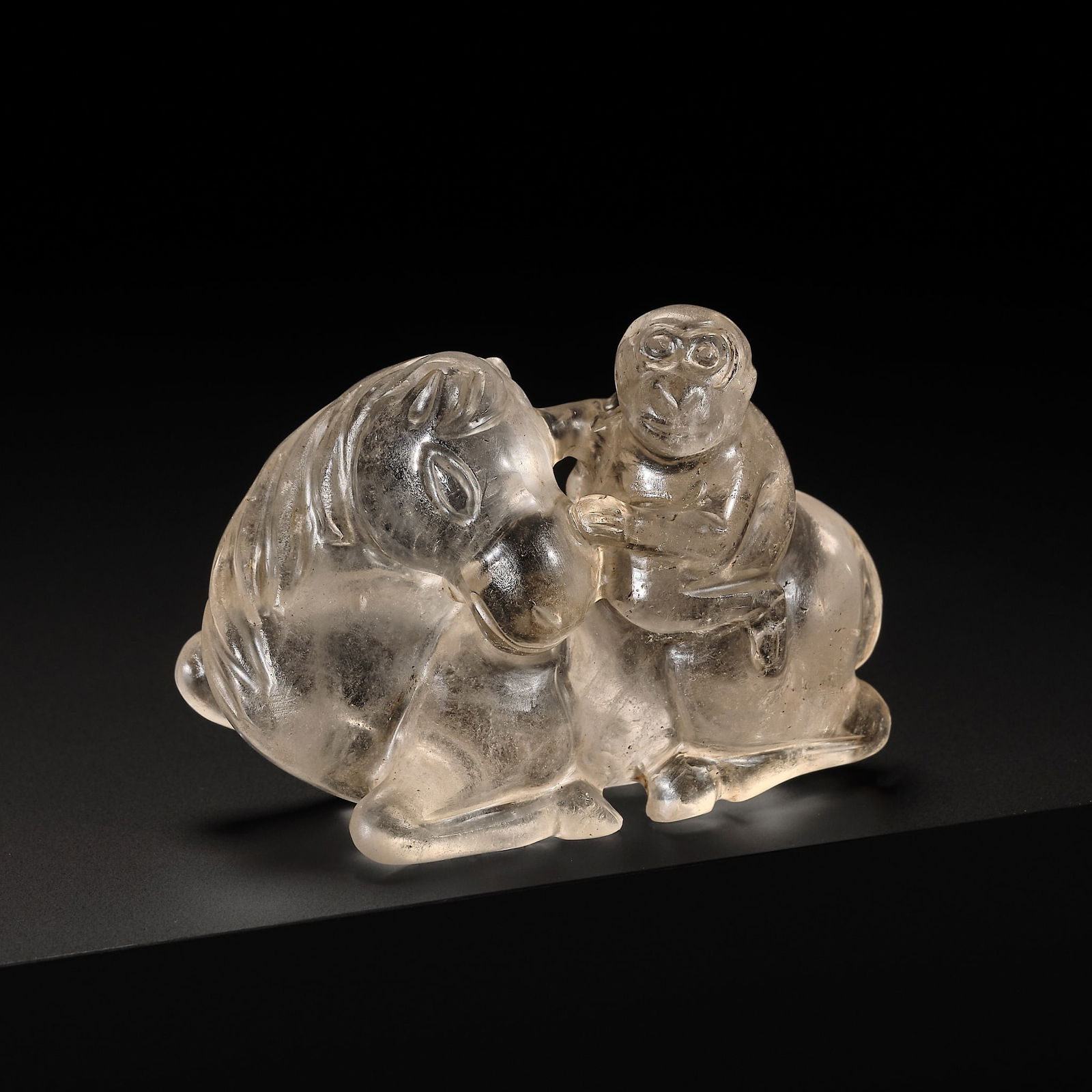 A FINE ROCK CRYSTAL CARVING OF A MONKEY RIDING A HORSE, LIAO DYNASTY (1 of 14)