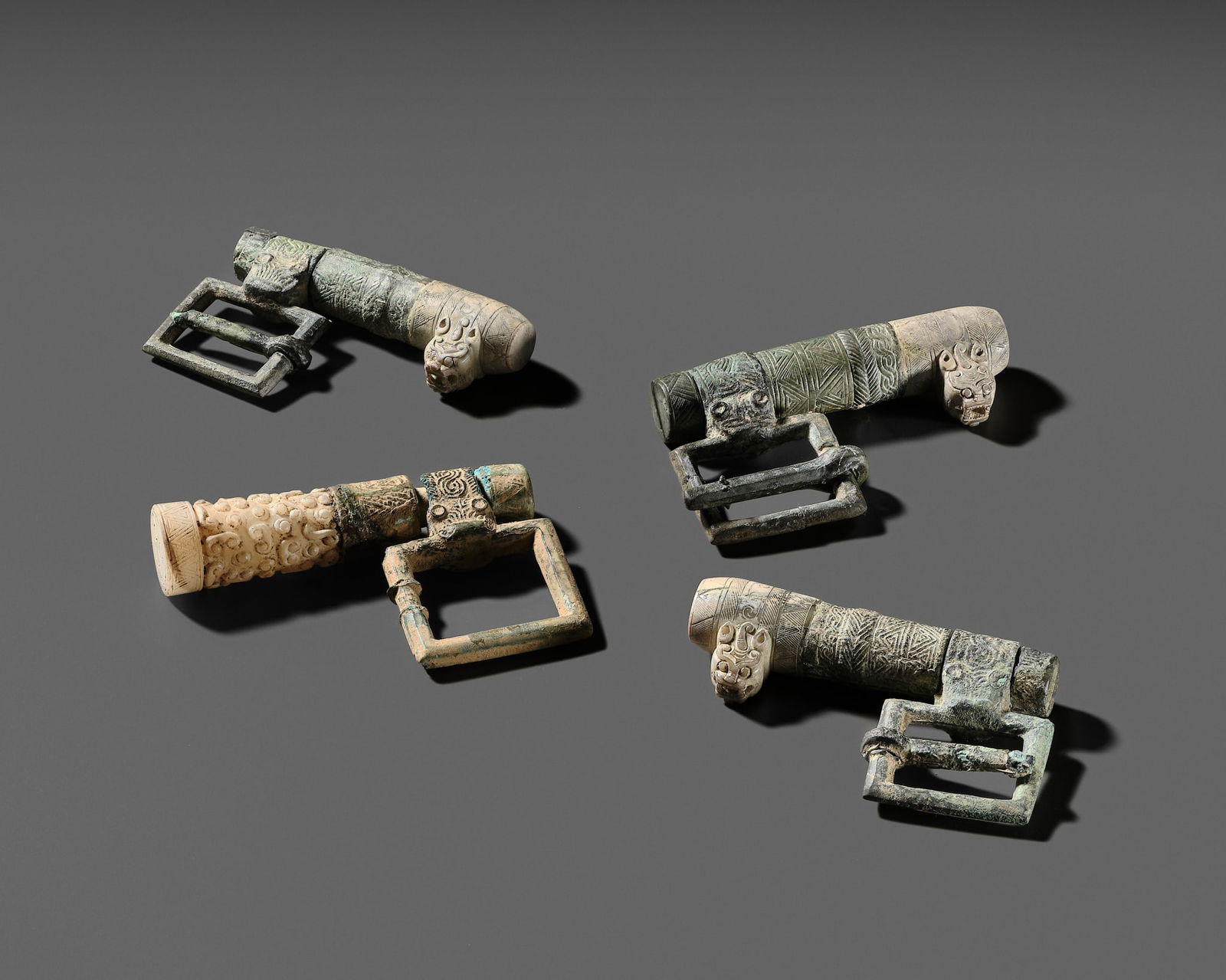 A GROUP LOT WITH FOUR RARE JADE AND BRONZE HARNESS ELEMENTS, EASTERN ZHOU DYNASTY (1 of 16)