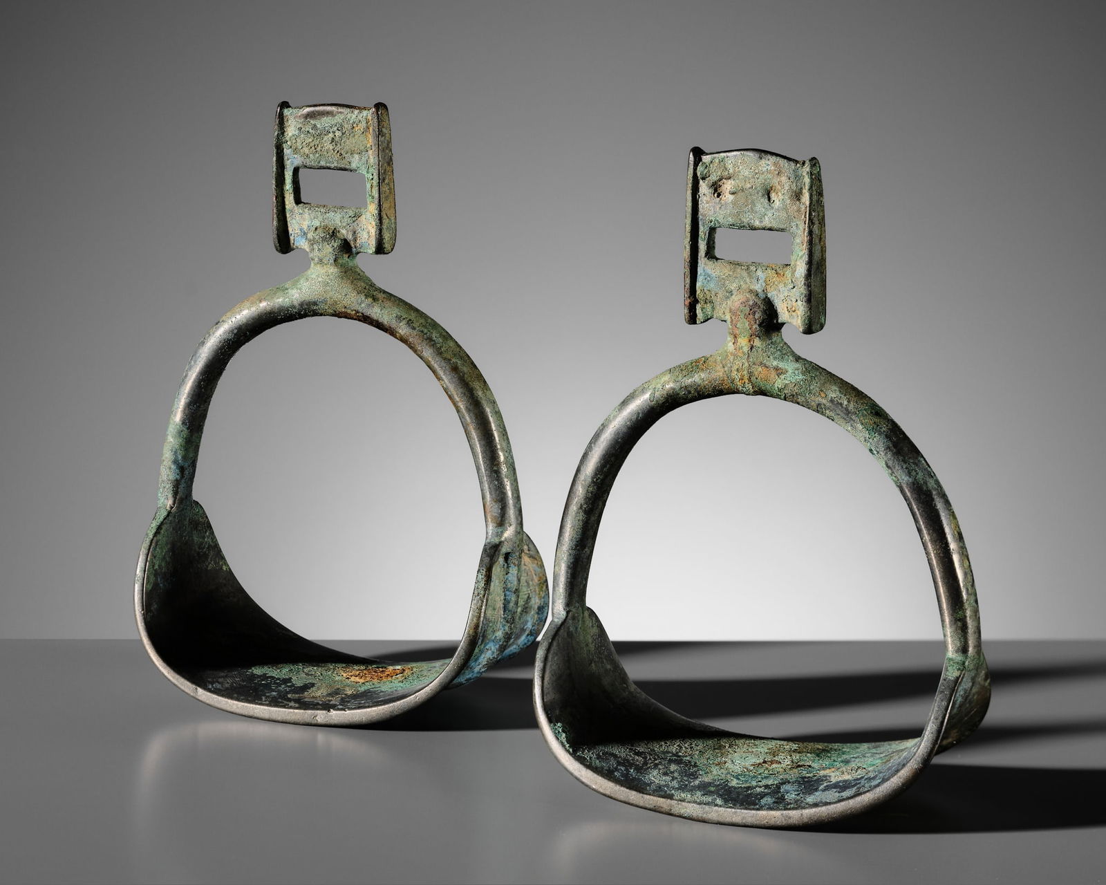 A PAIR OF RARE SILVERED COPPER ALLOY STIRRUPS, TANG DYNASTY (1 of 12)