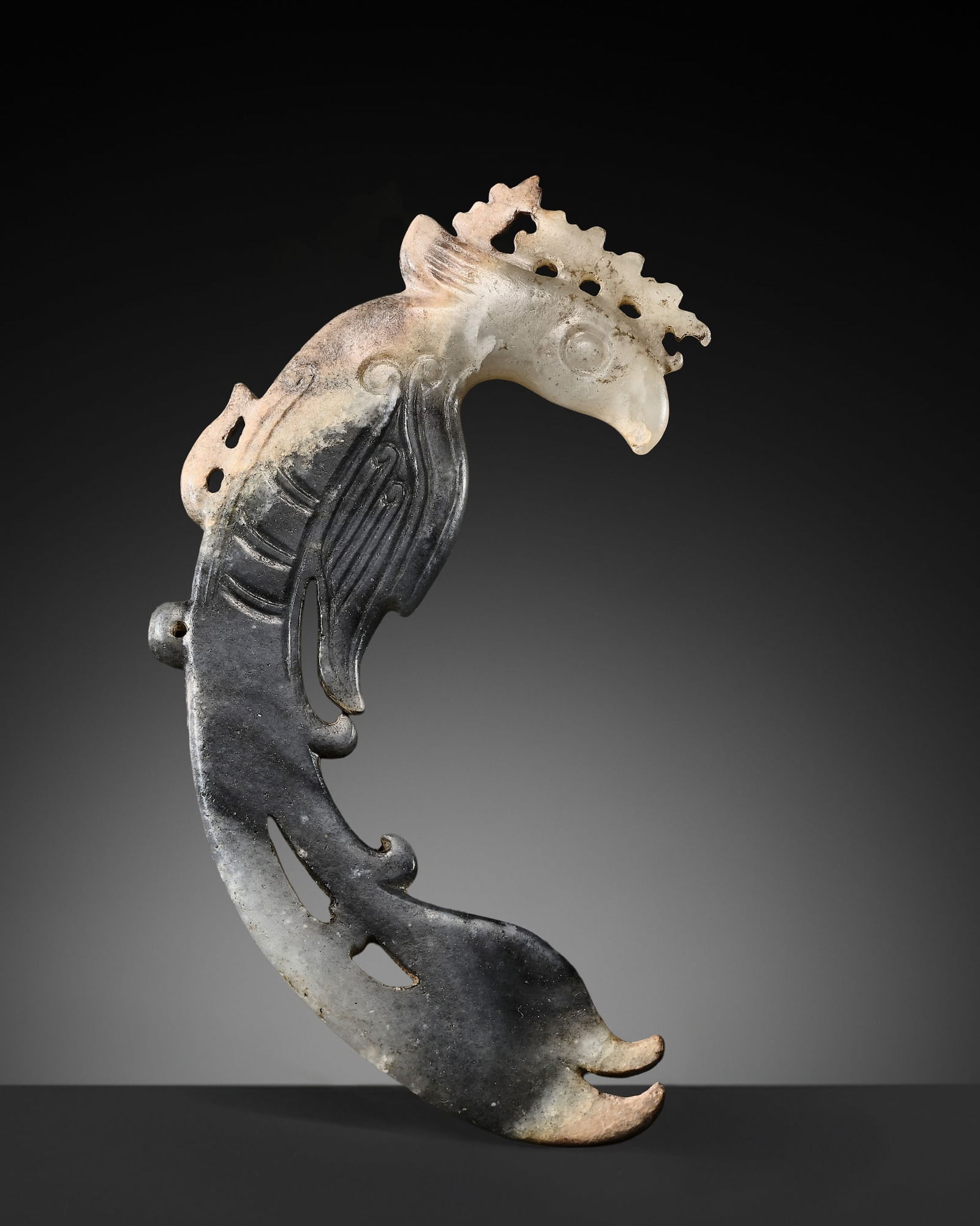 A RARE GRAY AND WHITE JADE CARVING OF A PHOENIX, LATE NEOLITHIC PERIOD, SHIJIAHE CULTURE: A RARE GRAY AND WHITE JADE CARVING OF A PHOENIX, LATE NEOLITHIC PERIOD, SHIJIAHE CULTURE Published: Filippo Salviati, 4000 Years of Chinese Archaic Jades, 2017, p. 40, no. 45.