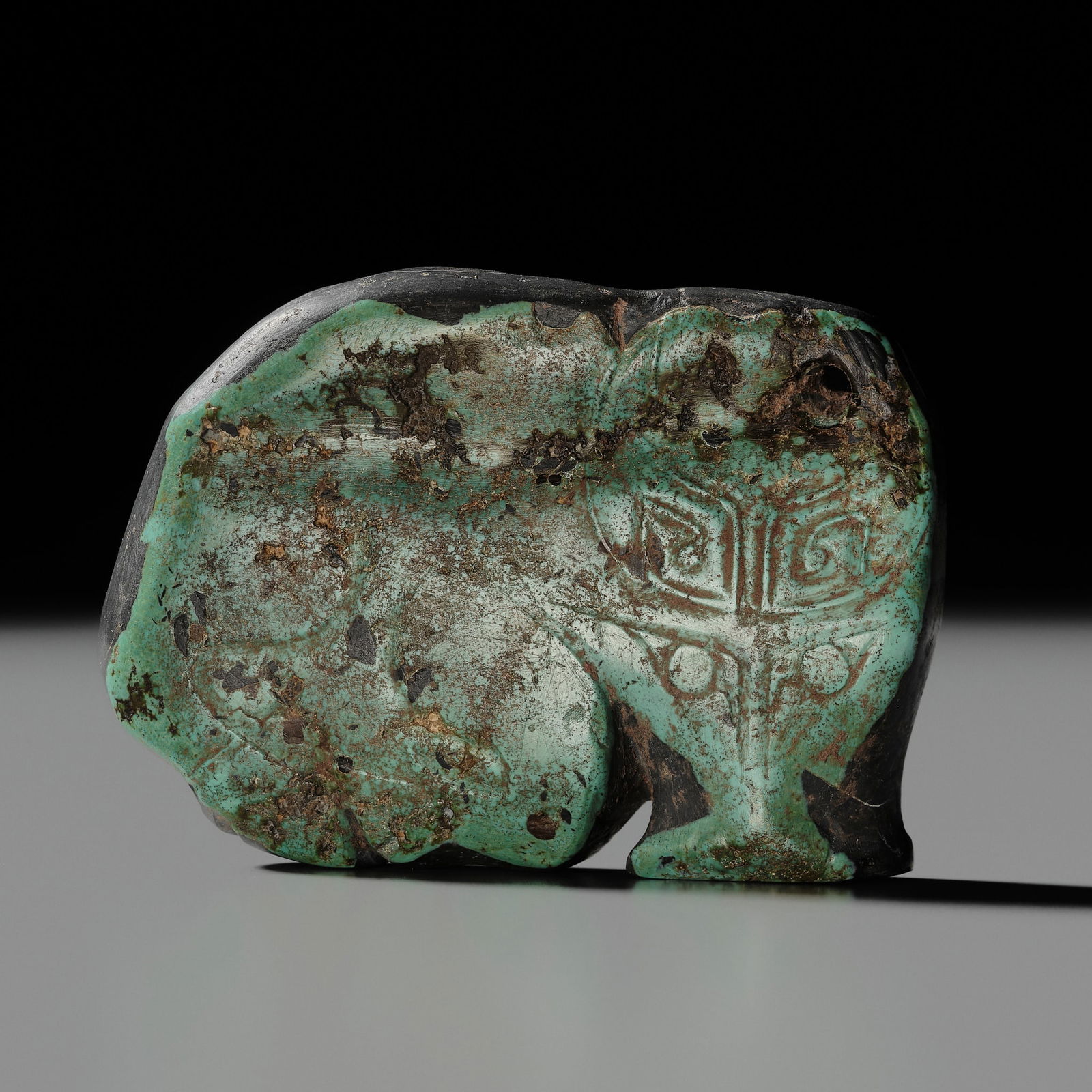 A VERY RARE TURQUOISE 'WATER BUFFALO' PENDANT, LATE SHANG TO EARLY WESTERN ZHOU DYNASTY (1 of 12)