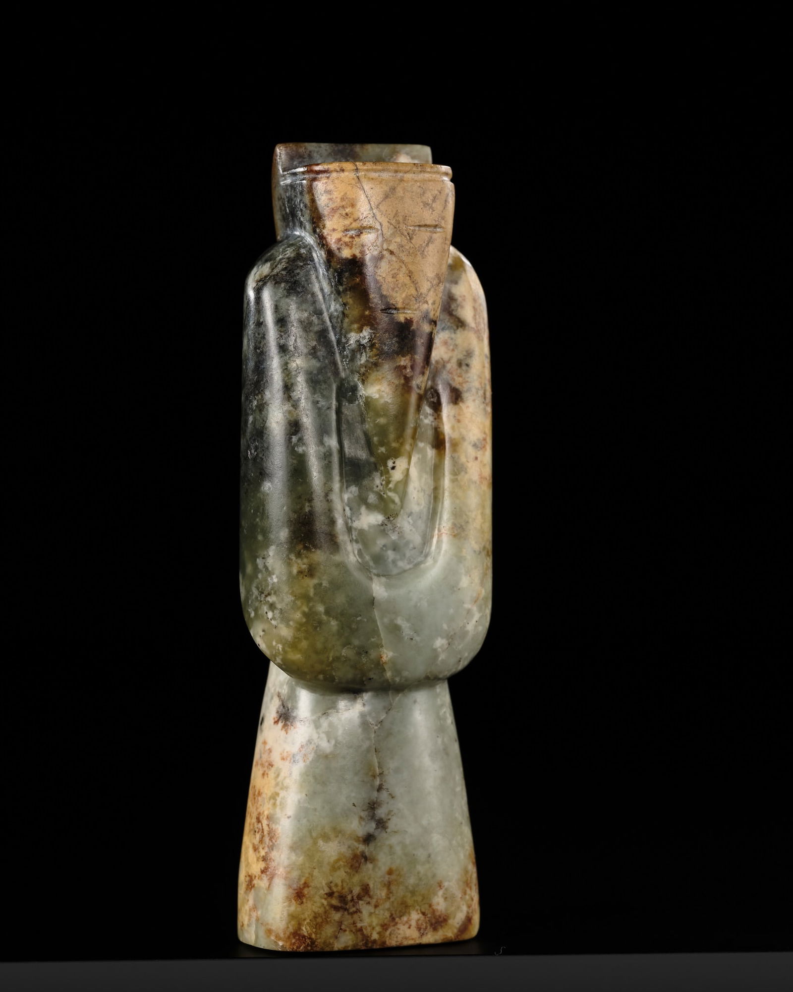 A MOTTLED GREEN AND BROWN JADE FIGURE OF A BEARDED SAGE, HAN DYNASTY (1 of 14)