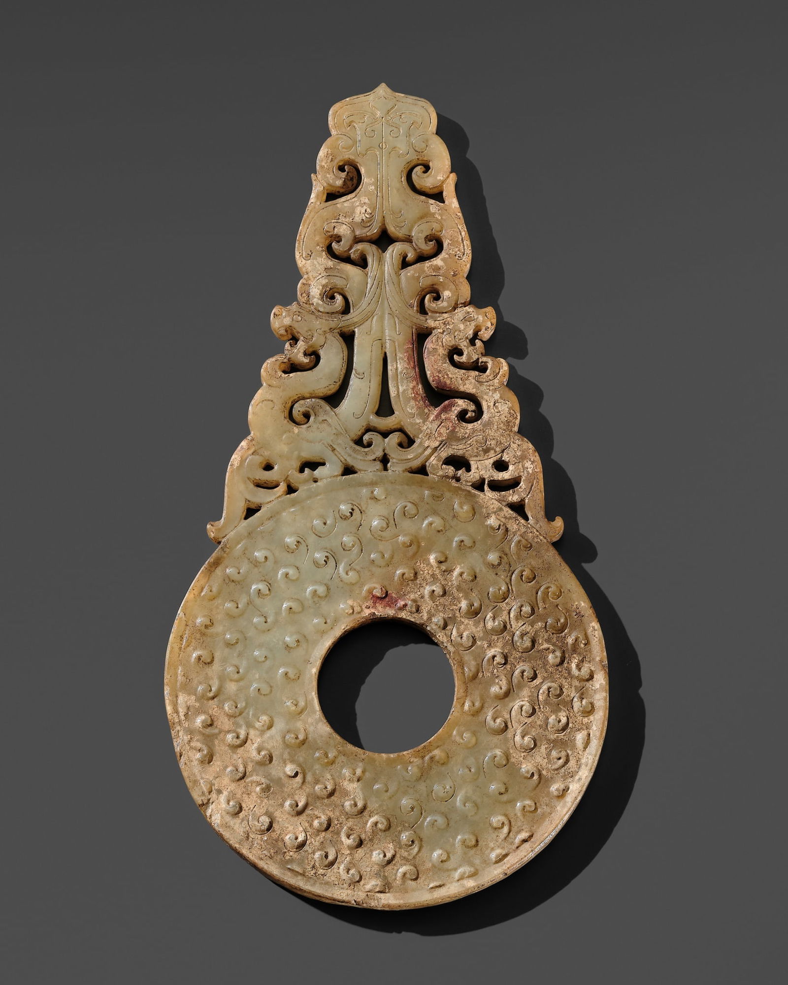 A PALE CELADON JADE DISC WITH DRAGONS, BI, WESTERN HAN DYNASTY (1 of 14)