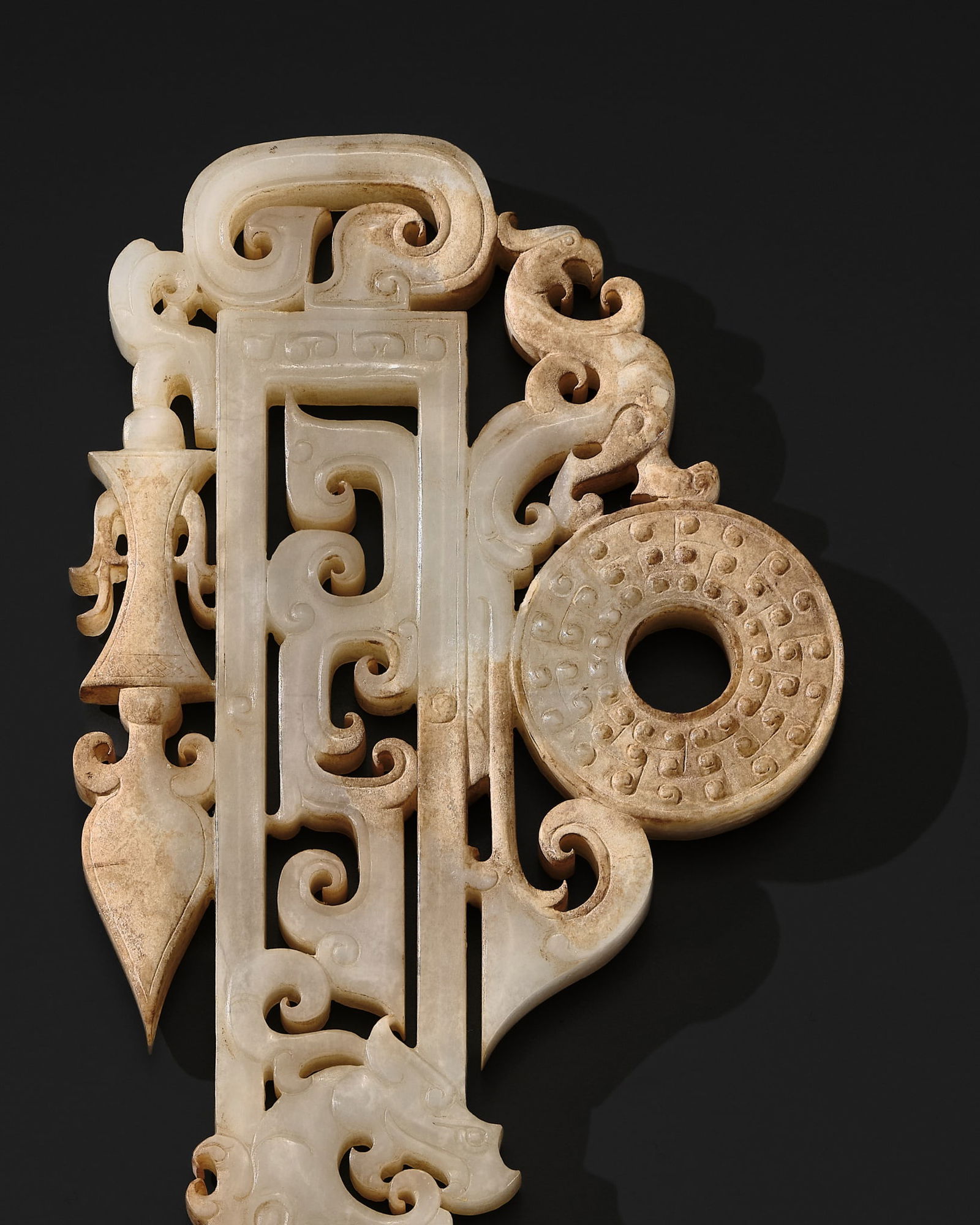 A WHITE AND RUSSET 'PHOENIX AND DRAGON' JADE ORNAMENT, HAN DYNASTY (1 of 18)