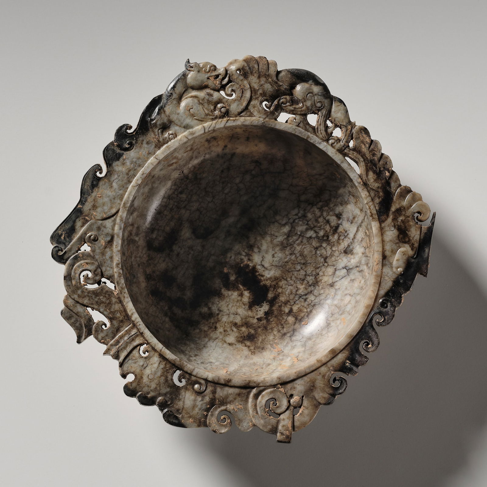 A GREY AND BROWN JADE OPENWORK BRUSH WASHER (XI), HAN DYNASTY (1 of 14)