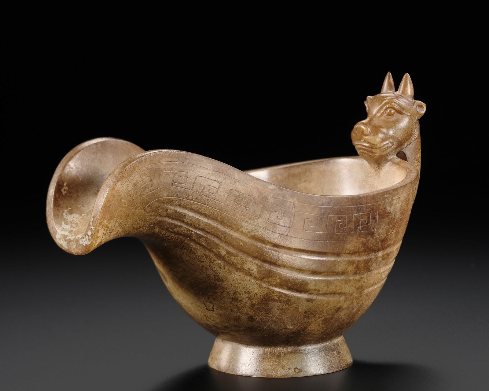 A BROWN JADE POURING VESSEL, YI, HAN DYNASTY: A BROWN JADE POURING VESSEL, YI, HAN DYNASTY Published: Jean-Paul Desroches (ed.) et al, The Beginning of the World. Dragons, Phoenix and Other Chimera, Fondation Baur, Geneva, 2020, p.