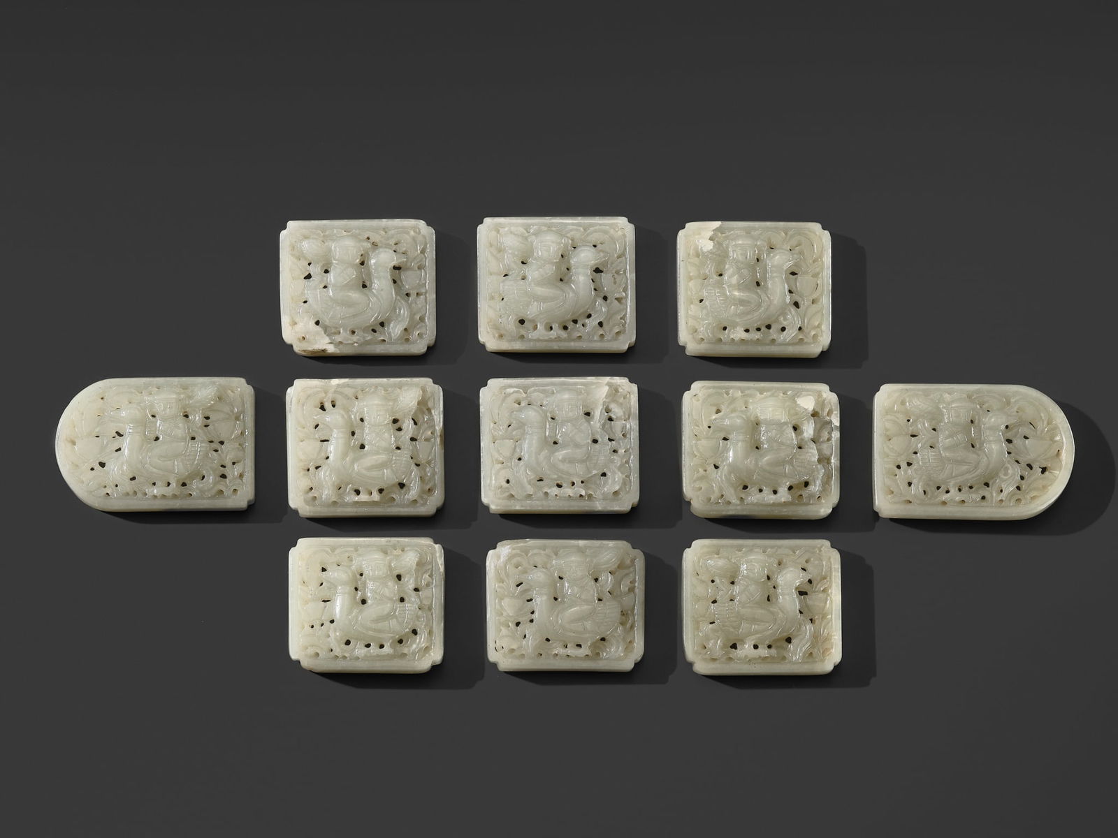 A RARE SET OF ELEVEN PALE WHITE JADE 'BOY AND GOOSE' BELT PLAQUES, LIAO DYNASTY: A RARE SET OF ELEVEN PALE WHITE JADE 'BOY AND GOOSE' BELT PLAQUES, LIAO DYNASTY Published: Myrna Myers (ed.) & Filippo Salviati (auth.), The Language of Adornment. Chinese Ornaments