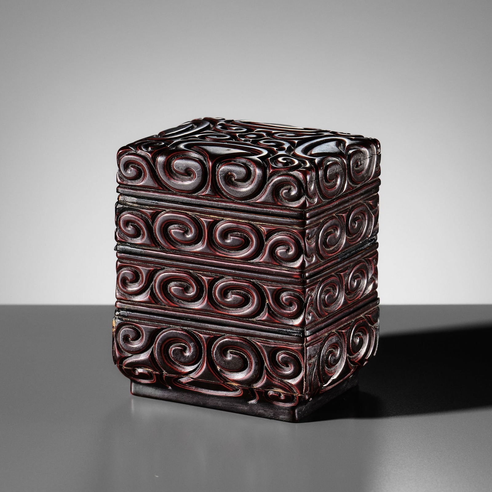A RARE THREE-TIERED BLACK AND CINNABAR TIXI LACQUER BOX, MING DYNASTY (1 of 12)