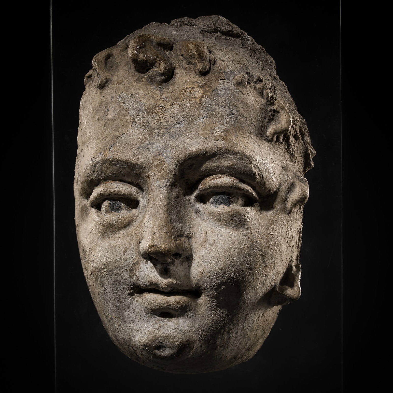 A STUCCO HEAD OF A YOUTH, GREATER GREECE, HELLENISTIC PERIOD, 3RD CENTURY BC: A STUCCO HEAD OF A YOUTH, GREATER GREECE, HELLENISTIC PERIOD, 3RD CENTURY BC Published: Jean-Paul Desroches (ed.) et al, Two Americans in Paris. A Quest for Asian Art, Paris, 2016, p. 1