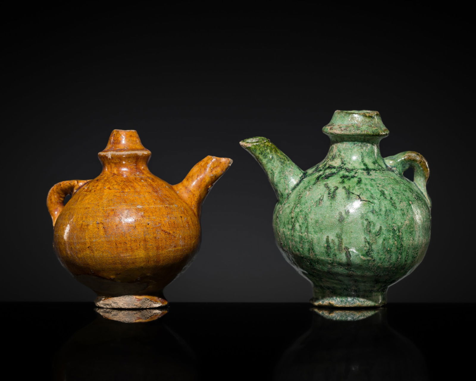 TWO MINIATURE AMBER- AND GREEN-GLAZED EARTHENWARE EWERS, LIAO DYNASTY (1 of 12)