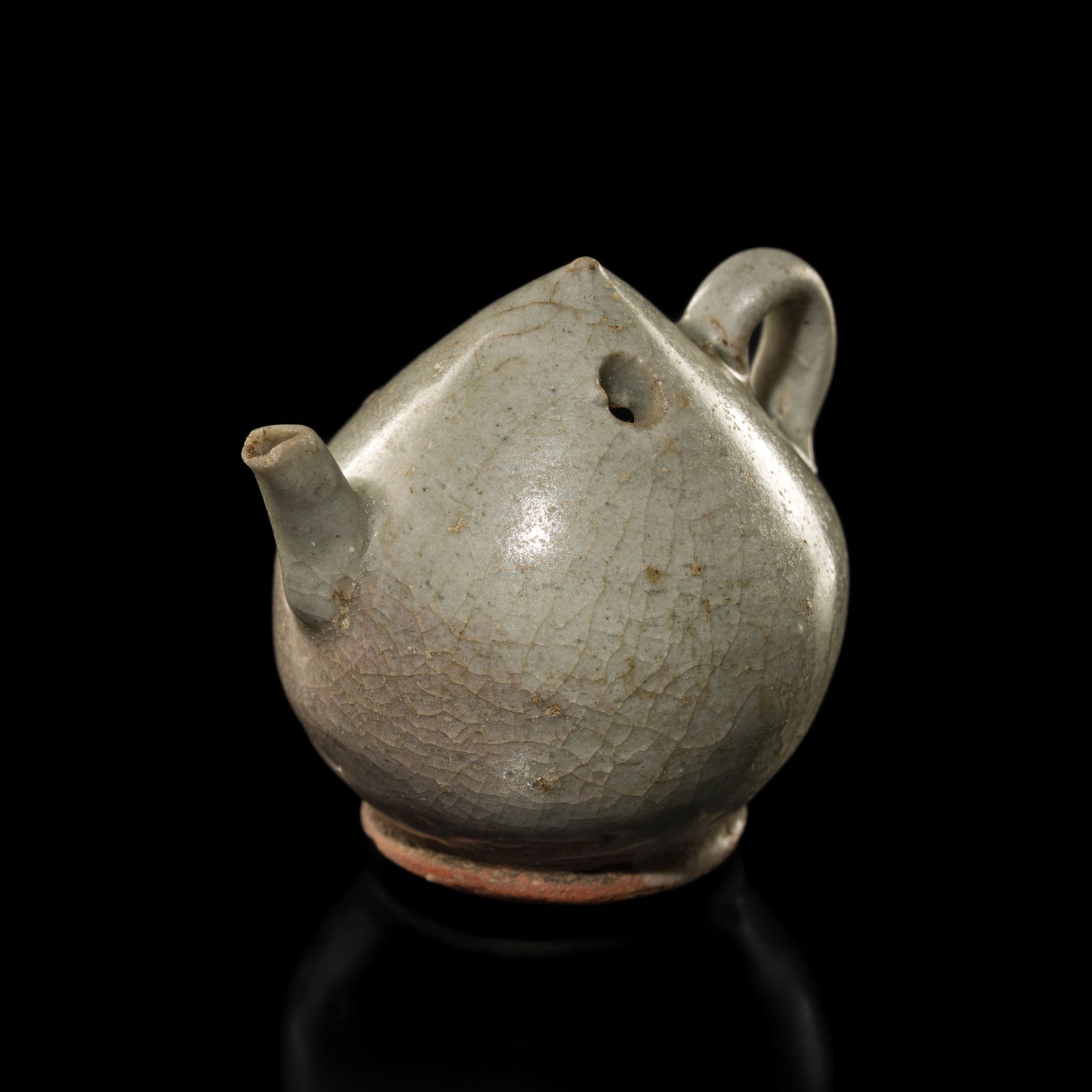 A SMALL CELADON-GLAZED STONEWARE 'PEACH' WATER DROPPER, SOUTHERN SONG TO YUAN DYNASTY: A SMALL CELADON-GLAZED STONEWARE 'PEACH' WATER DROPPER, SOUTHERN SONG TO YUAN DYNASTY China, 13th-14th century. Well-potted, the bud-shaped body supported on a short, waisted foot and rising to a