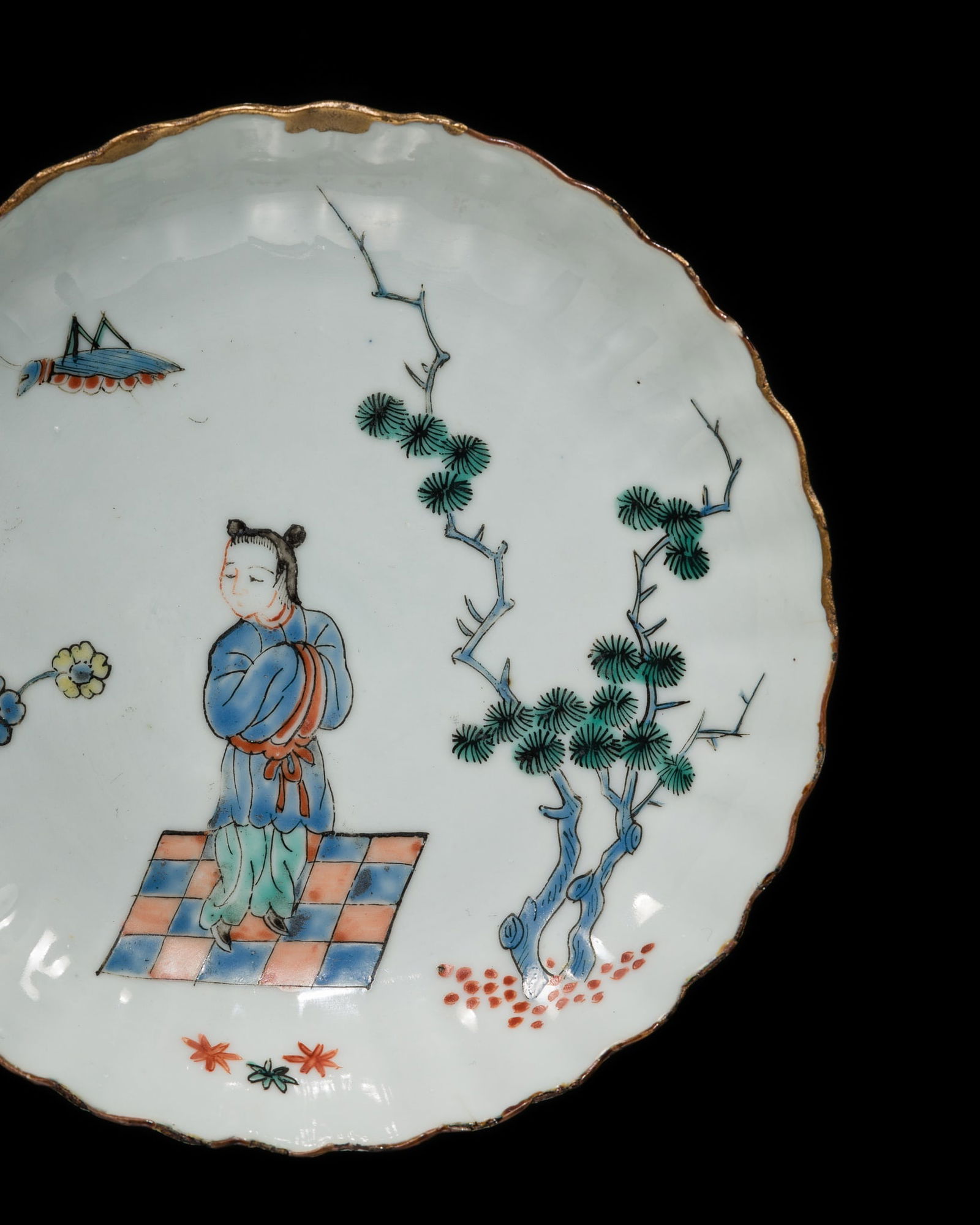 A CHARMING ENAMELED FOLIATE SAUCER DISH, CHONGZHEN PERIOD: A CHARMING ENAMELED FOLIATE SAUCER DISH, CHONGZHEN PERIOD China, 1628-1644. The lobed dish sides rising from a short, circular foot delicately painted with blue, red, green, orange and yellow enamels