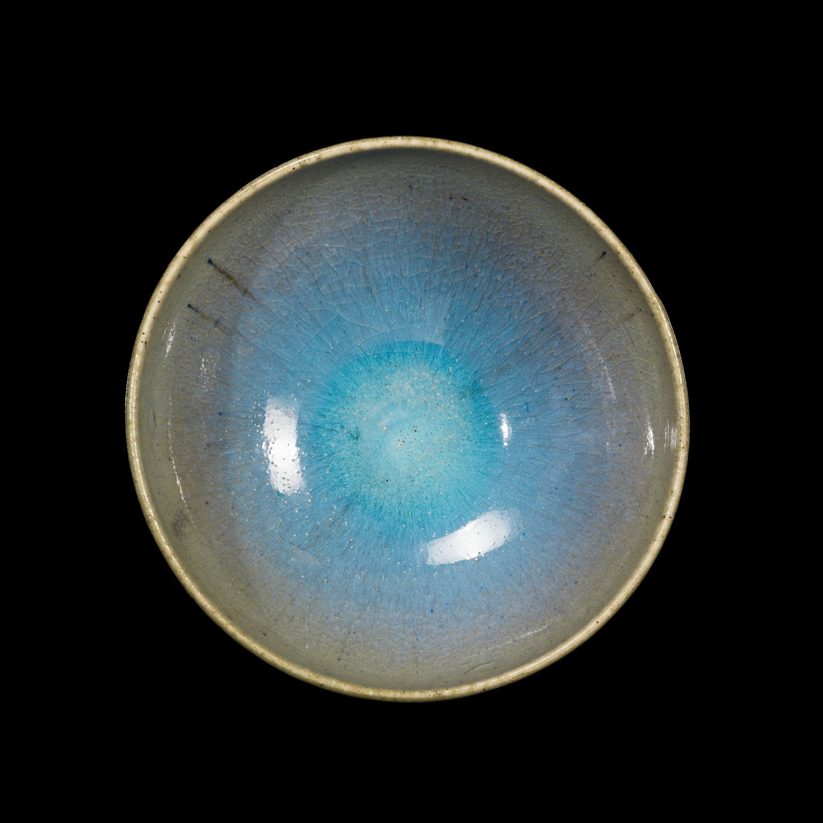 A BLUE-GLAZED JUN BOWL, LATE MING TO MID-QING DYNASTY: A BLUE-GLAZED JUN BOWL, LATE MING TO MID-QING DYNASTY China, circa 17th to 18th century or earlier. Finely potted with deep, rounded sides rising from a short foot, covered overall