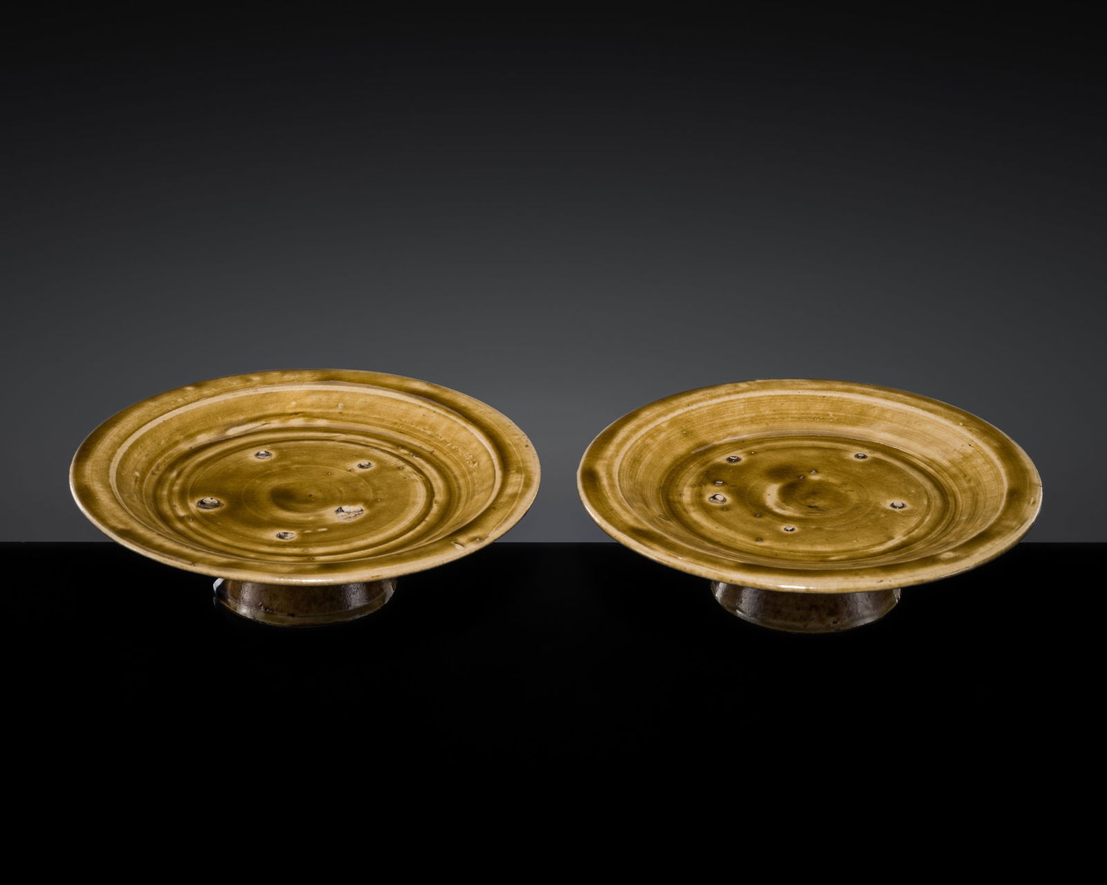 A PAIR OF BROWN-GLAZED STONEWARE STEM DISHES, FROM THE ZHANG FAMILY OF TONGCHENG (1 of 9)