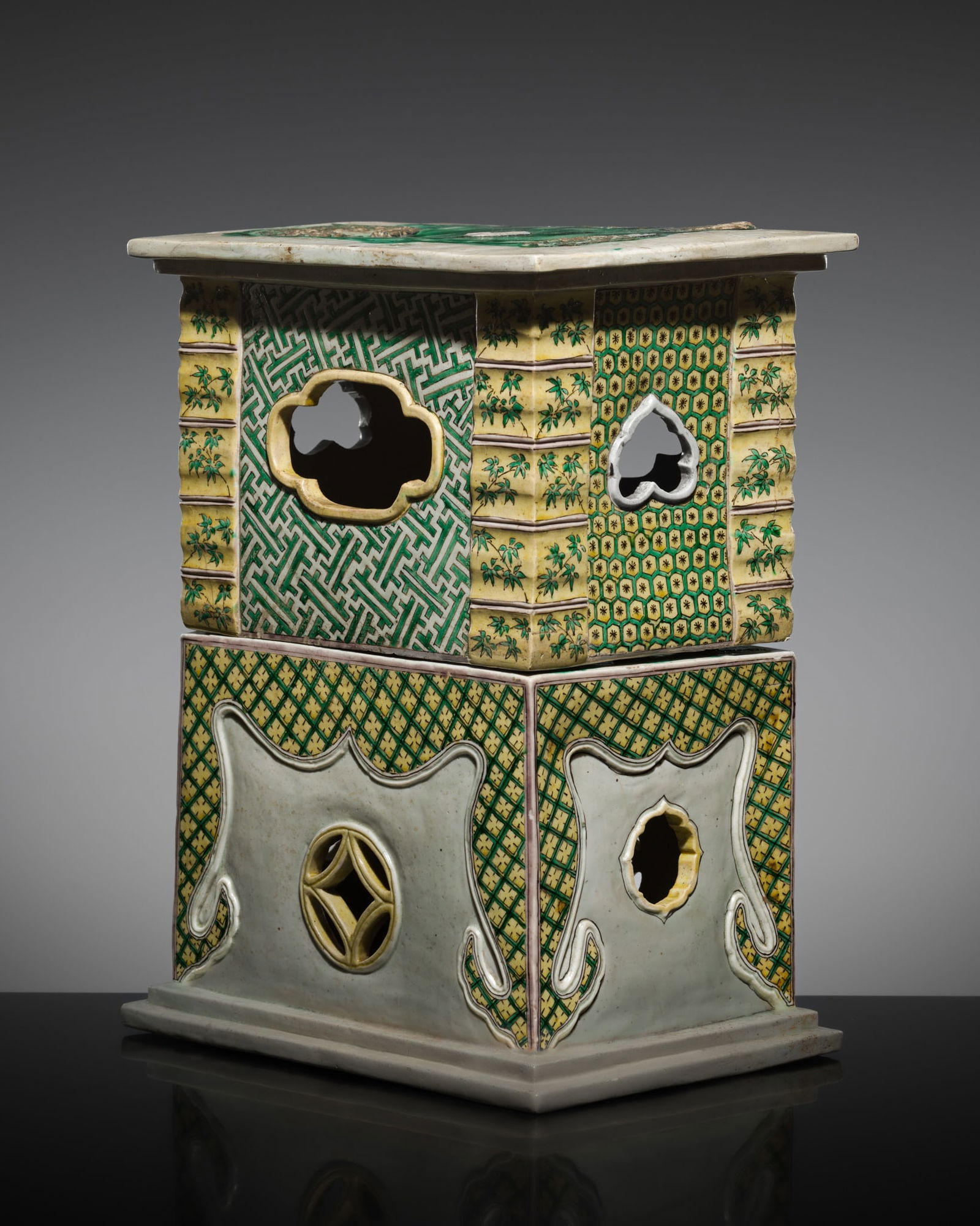 TWO STACKABLE 'FAMILLE VERTE' PORCELAIN STANDS, QING DYNASTY, KANGXI PERIOD: TWO STACKABLE 'FAMILLE VERTE' PORCELAIN STANDS, QING DYNASTY, KANGXI PERIOD China, 1662-1722. Each heavily potted, of rectangular form, the lower section with a stepped foot rim, while the upper stan