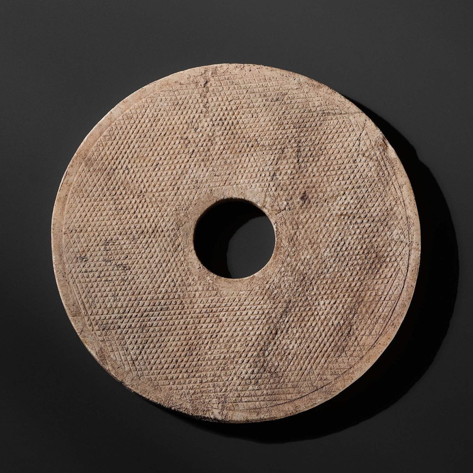 A REDDISH-BROWN MARBLE DISC, BI, EASTERN ZHOU PERIOD: A REDDISH-BROWN MARBLE DISC, BI, EASTERN ZHOU PERIOD Published: Myrna Myers (ed.) & Filippo Salviati (auth.), Radiant Stones. Archaic Chinese Jades, Paris, 2000, no. 85.