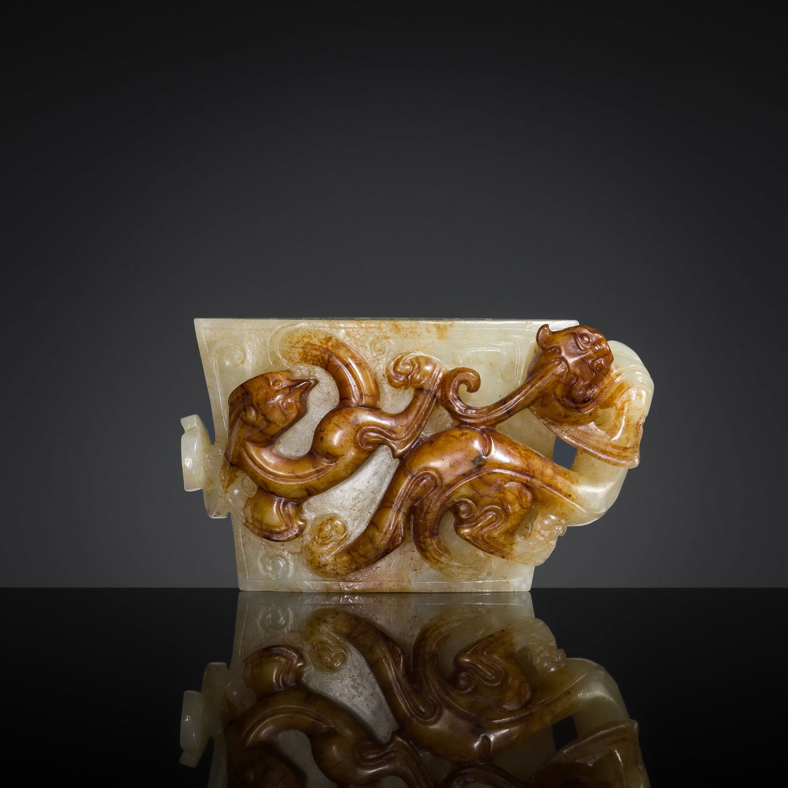 A MAGNIFICENT WHITE AND RUSSET JADE 'DRAGON' SCABBARD CHAPE, WESTERN HAN DYNASTY (1 of 15)