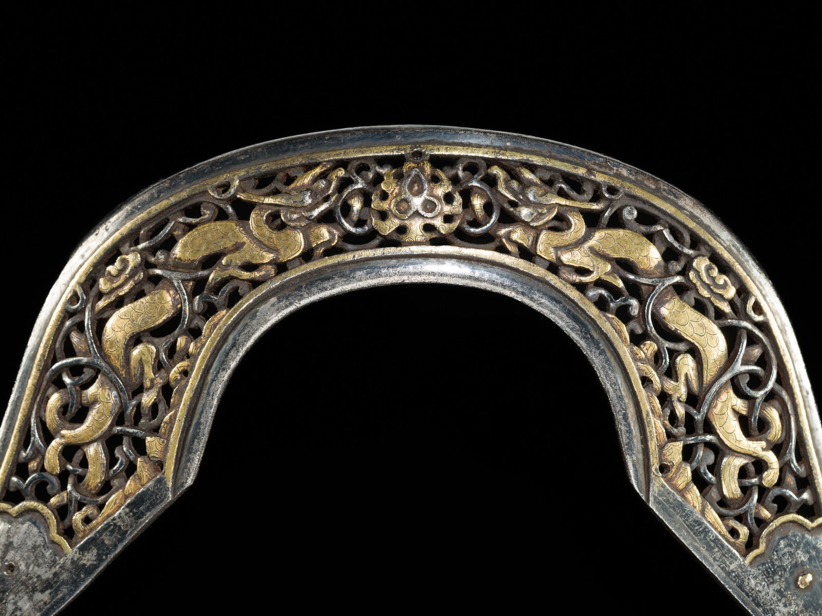 A PARCEL-GILT IRON 'DRAGON' POMMEL PLATE FROM A HORSE SADDLE (1 of 12)