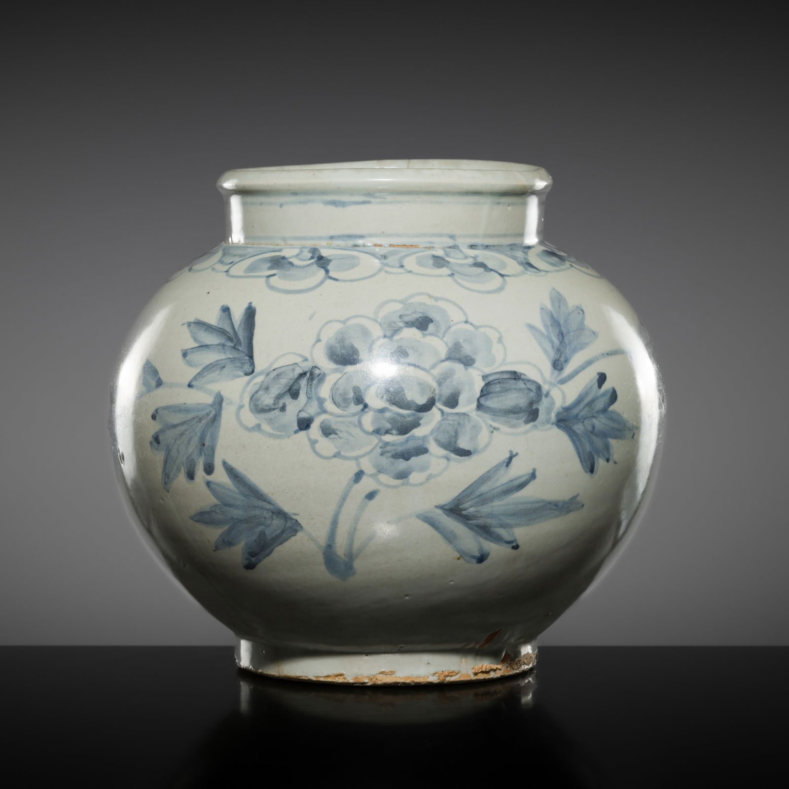 A LARGE BLUE AND WHITE PORCELAIN 'PEONIES' JAR, JOSEON DYNASTY: A LARGE BLUE AND WHITE PORCELAIN 'PEONIES' JAR, JOSEON DYNASTY Korea, 18th-19th century. Heavily potted, the globular body supported on a short, straight foot and rising to a cylindrical neck with a