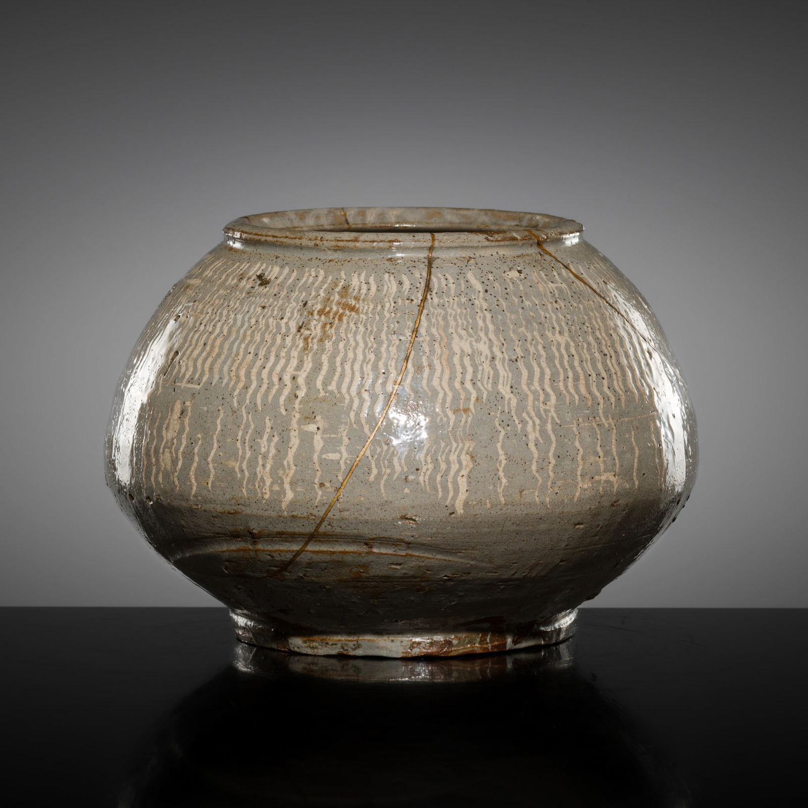 A PALE BLUE-GLAZED KARATSU WARE FRESH WATER JAR (MIZUSASHI), MOMOYAMA TO EARLY EDO PERIOD (1 of 14)