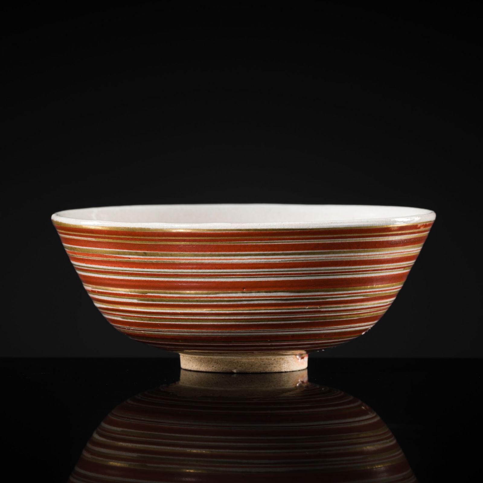 A RARE UTSUTSUGAWA-STYLE RED- AND GOLD-GLAZED STONEWARE TEA BOWL (CHAWAN) (1 of 10)