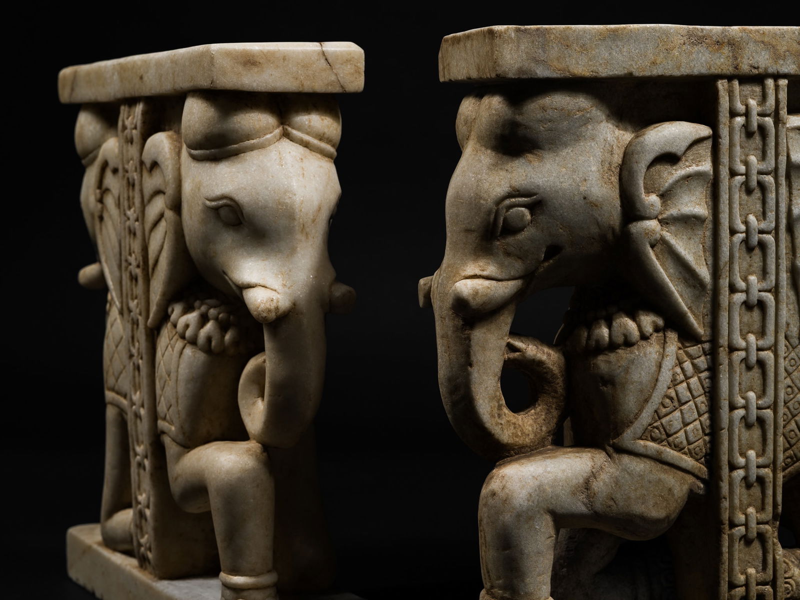 A PAIR OF FINELY CARVED WHITE MARBLE 'ELEPHANT' SUPPORTS, RAJASTHAN (1 of 12)