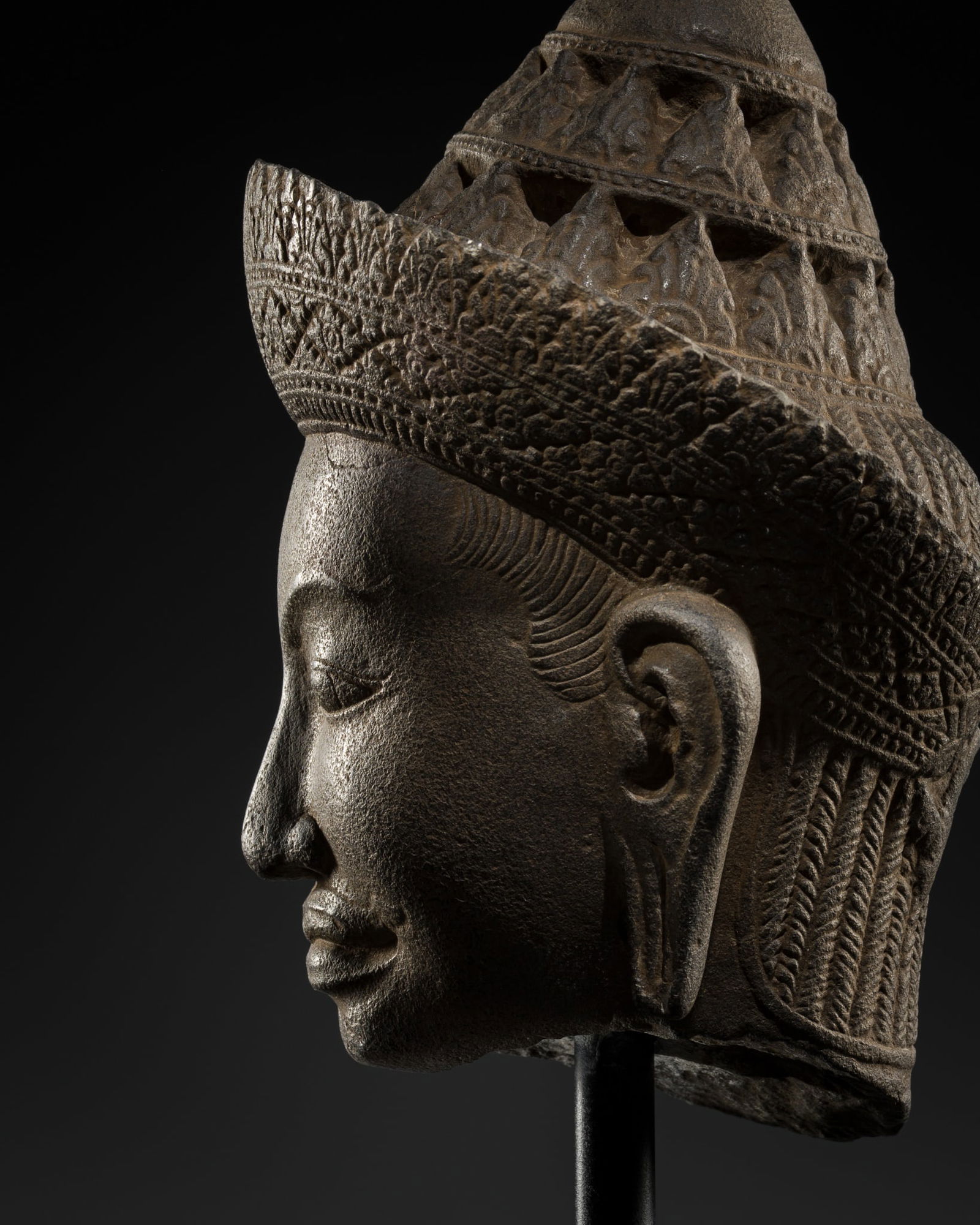 A FINE SANDSTONE HEAD OF A MALE DEITY, BAPHUON STYLE, ANGKOR PERIOD (1 of 14)