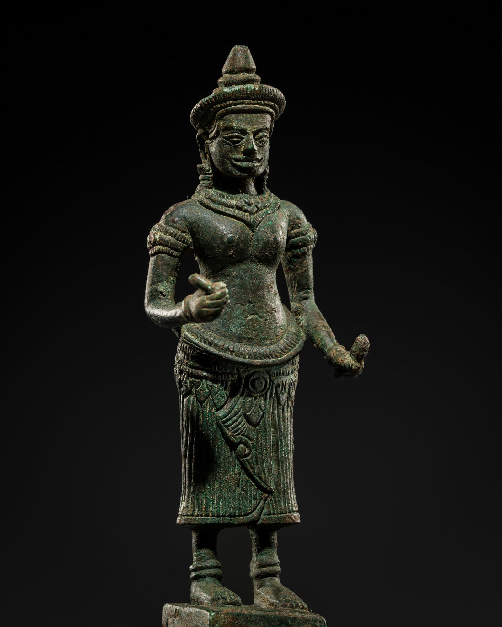 A BRONZE FIGURE OF A FEMALE DEITY, ANGKOR WAT STYLE, ANGKOR PERIOD, 12TH CENTURY (1 of 14)