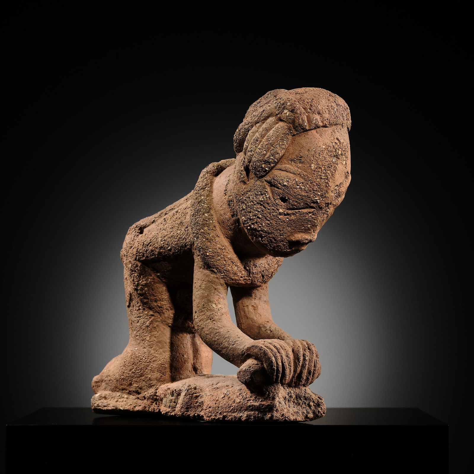 A RARE TERRACOTTA FIGURE OF A WOMAN GRINDING, NOK CULTURE, NIGERIA, 500 BC - 200 AD (1 of 13)