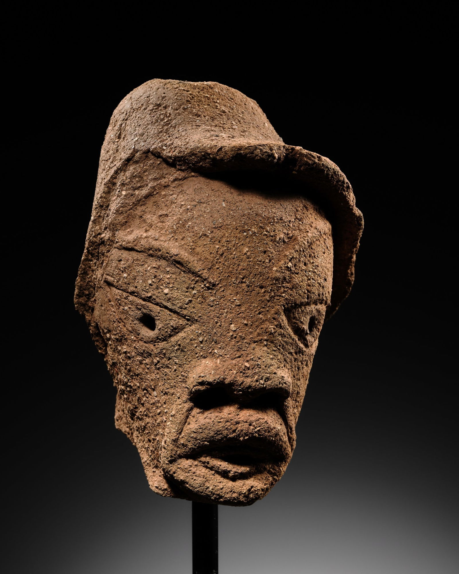 A TERRACOTTA HEAD OF A MAN WEARING A HAT, NOK CULTURE, NIGERIA, 500 BC - 200 AD (1 of 13)