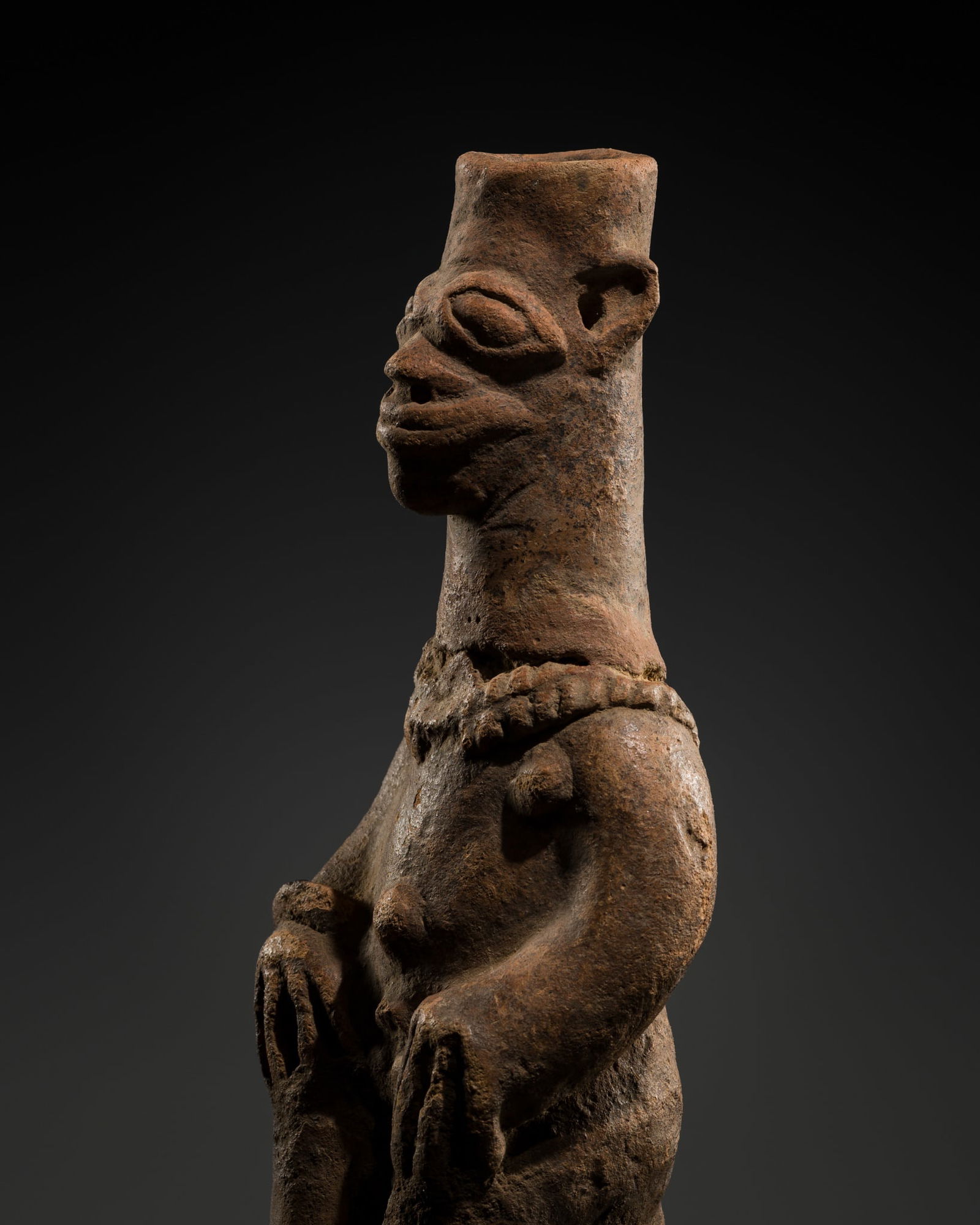 A TERRACOTTA SEATED FIGURE, NORTHERN GHANA, KOMALAND, 13TH-18TH CENTURY (1 of 11)