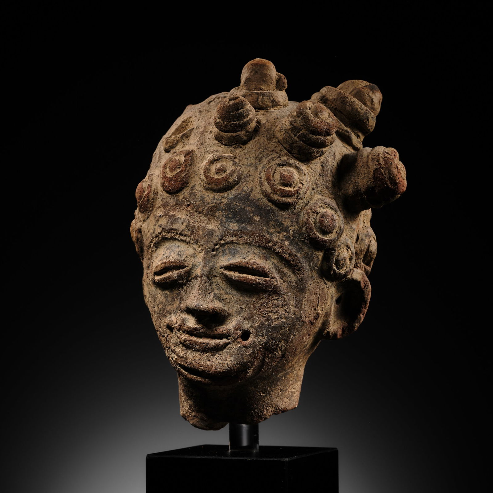 A TERRACOTTA MEMORIAL HEAD, NSODIE, AKAN PEOPLE, 17TH TO MID-18TH CENTURY (1 of 16)