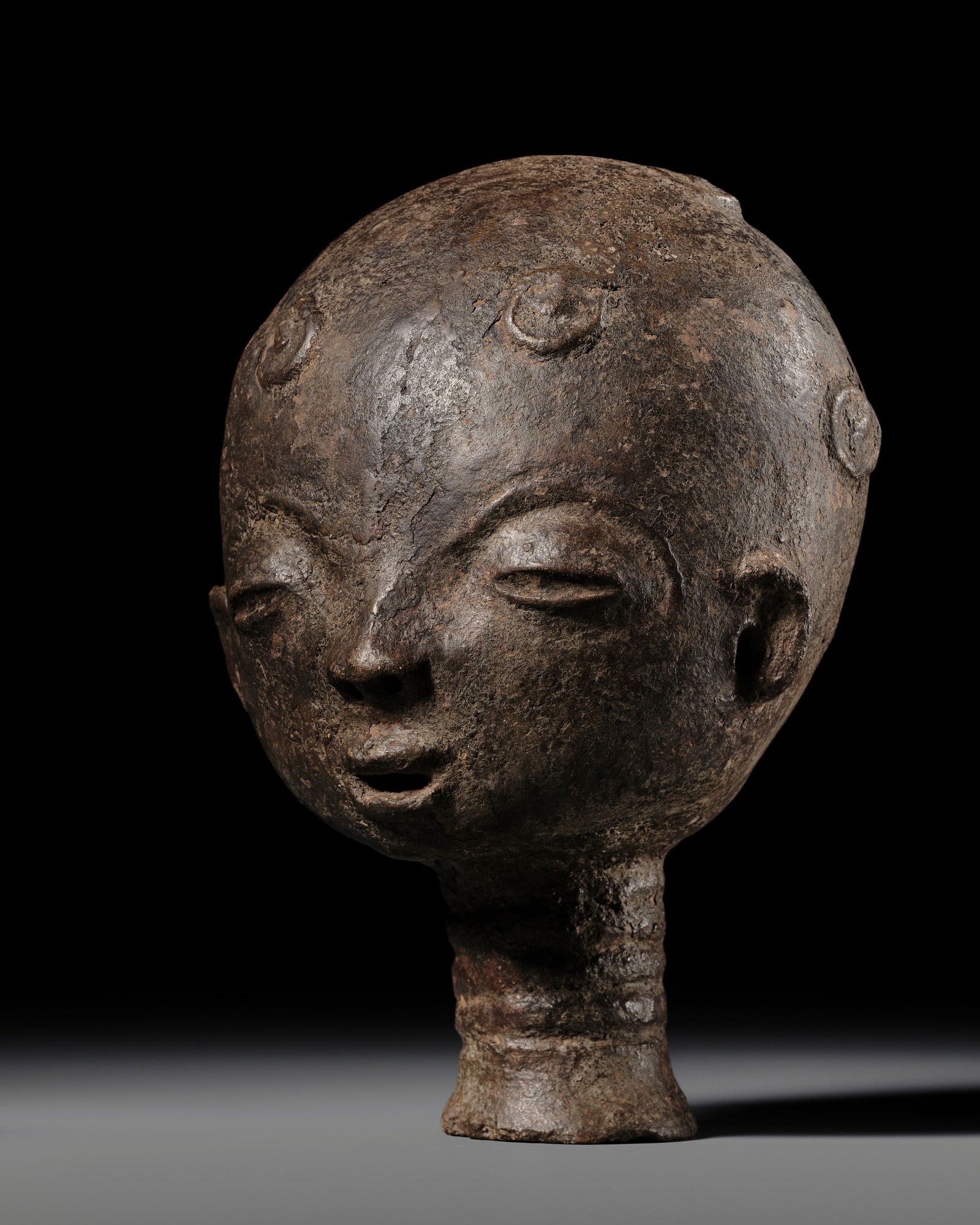 A BLACK TERRACOTTA MEMORIAL HEAD, NKUA, AKAN PEOPLE, SECOND HALF OF THE 19TH CENTURY (1 of 20)