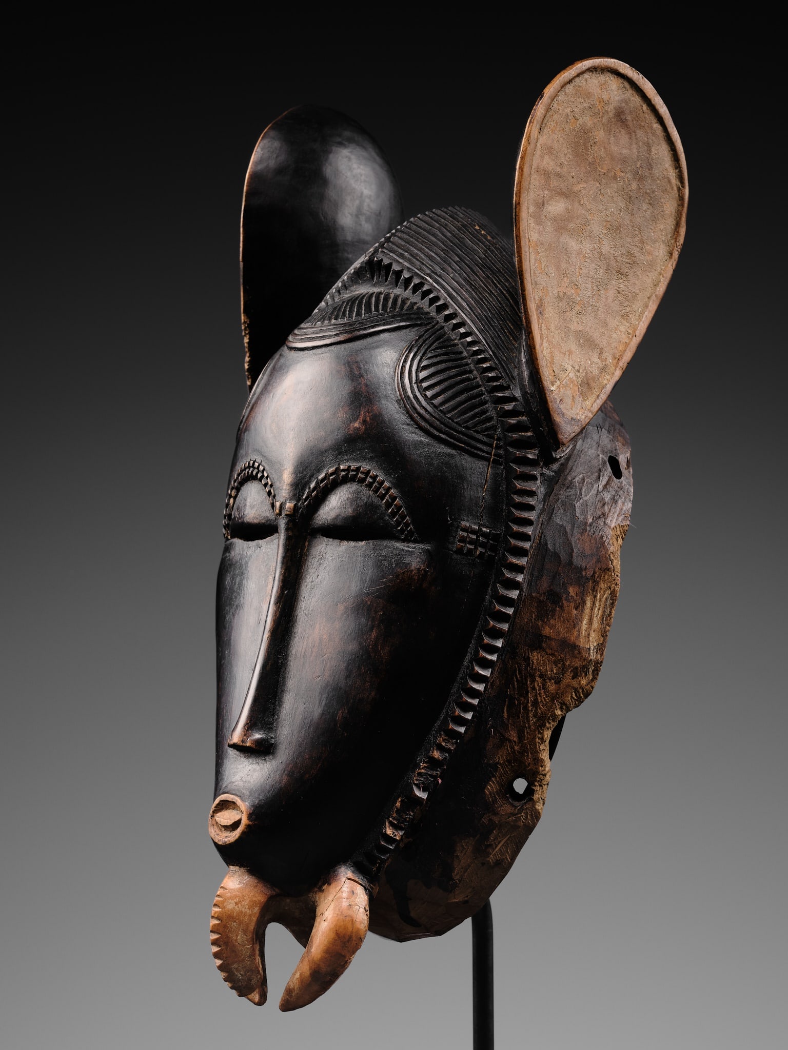 A CARVED WOOD 'ELEPHANT' MASK, BAULE CULTURE, CÔTE D'IVOIRE, LATE 19TH TO EARLY 20TH CENTURY (1 of 20)