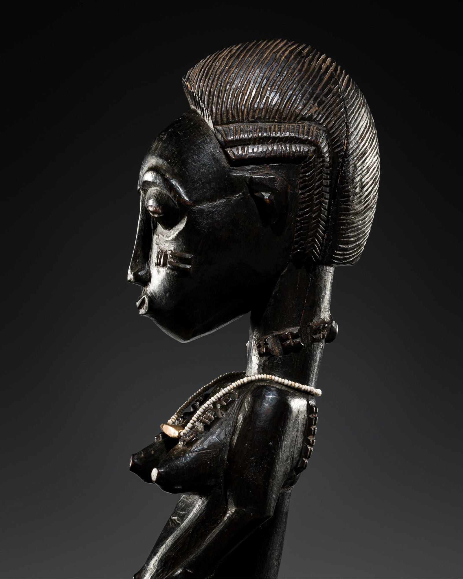 A WOOD 'BLOLO BLA' FIGURE, BAULE CULTURE, CÔTE D'IVOIRE, LATE 19TH TO MID-20TH CENTURY (1 of 13)