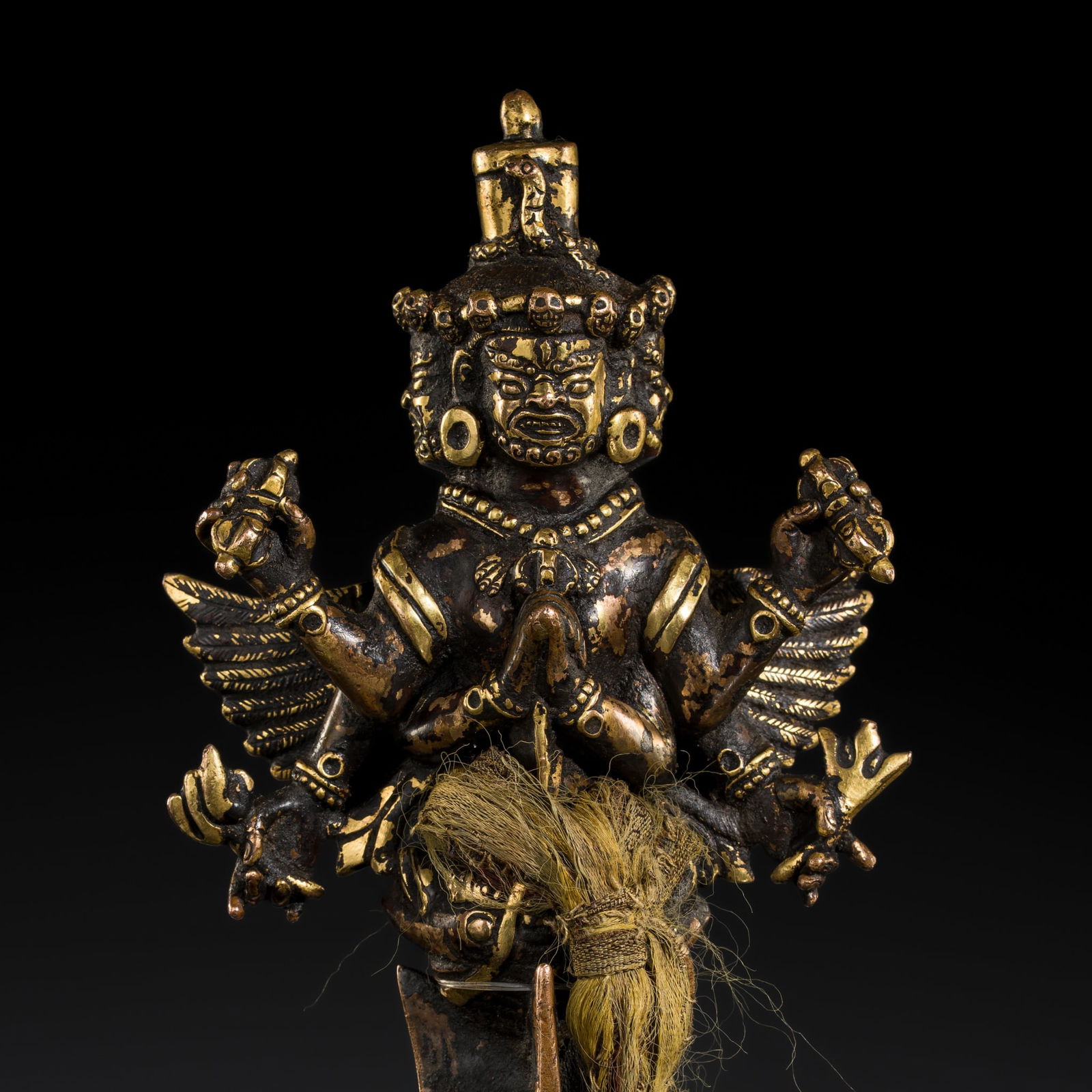 A RARE PARCEL-GILT COPPER VAJRAKILA PHURBA, 17TH CENTURY: A RARE PARCEL-GILT COPPER VAJRAKILA PHURBA, 17TH CENTURY This lot is from a single owner collection and is therefore offered without reserve Tibet. Powerfully cast, the pommel is adorned with three he