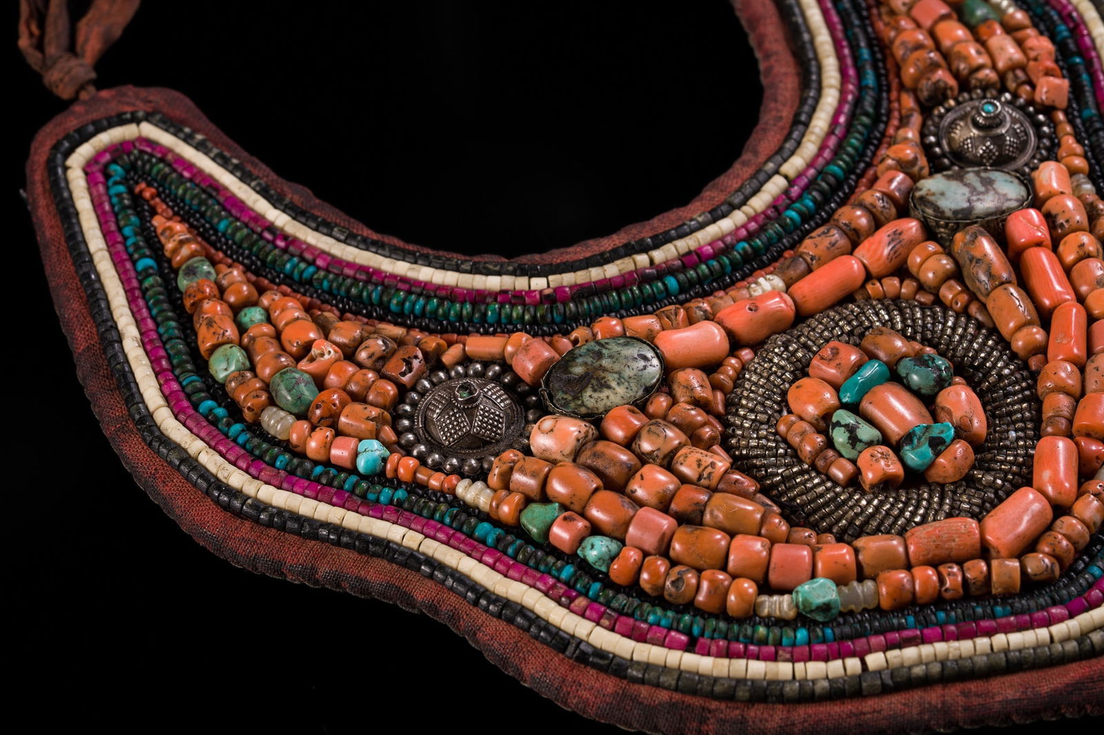 A FINE TURQUOISE, CORAL AND BONE INLAID PECTORAL, SKEYPUK, 19TH CENTURY (1 of 9)